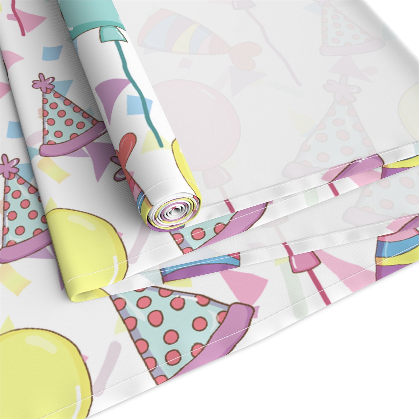 Back view of a table runner with birthday hats, confetti and purple, yellow, blue and pink balloons design on a white background