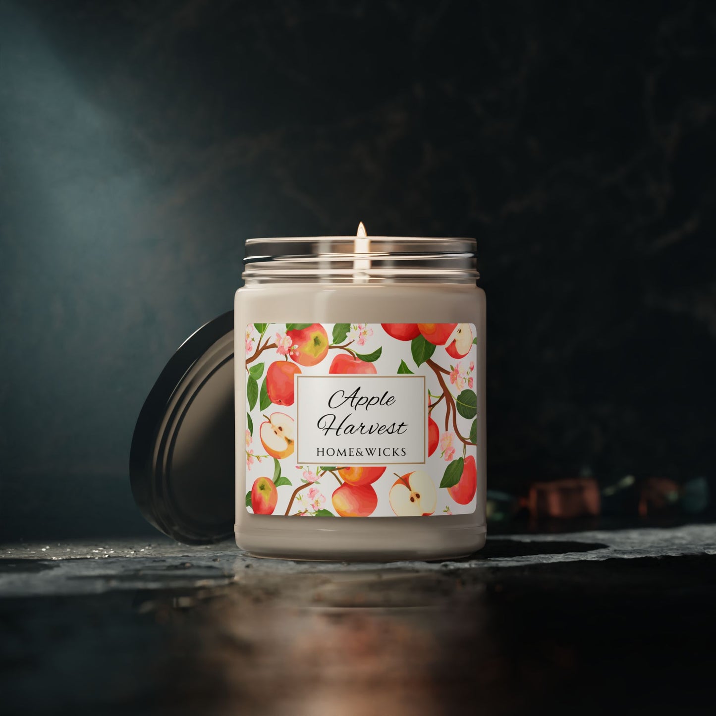 Home and wikes Apple Harvest candle on a dark background