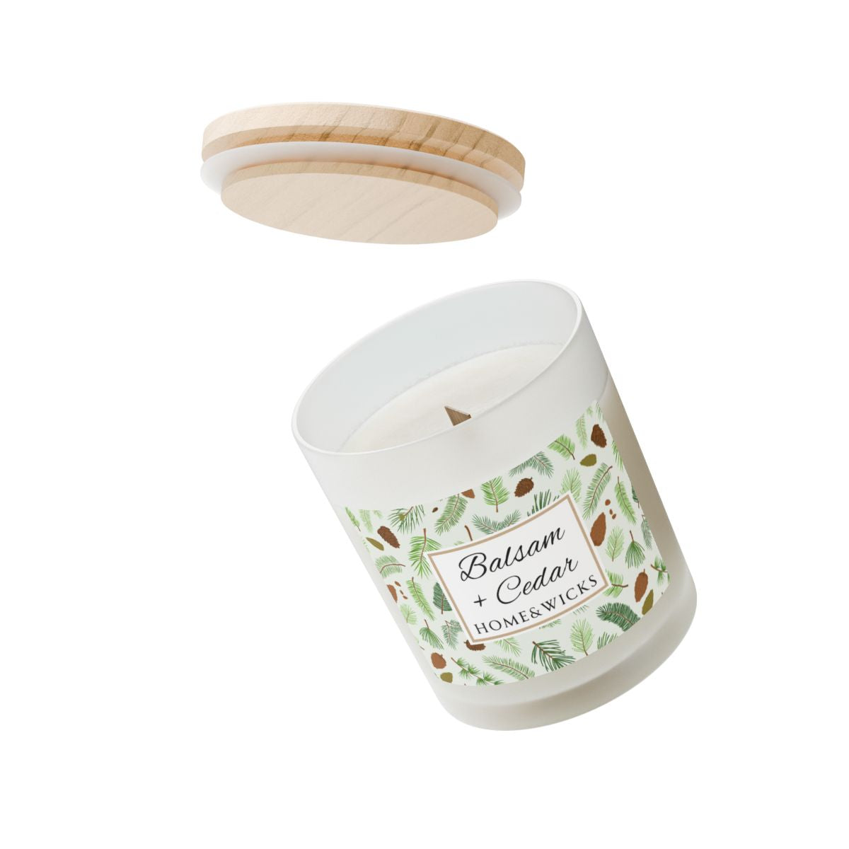 Wood wick candle with 'Balsam + Cedar' label with cones and cedar leaves on a white background by Home & Wicks