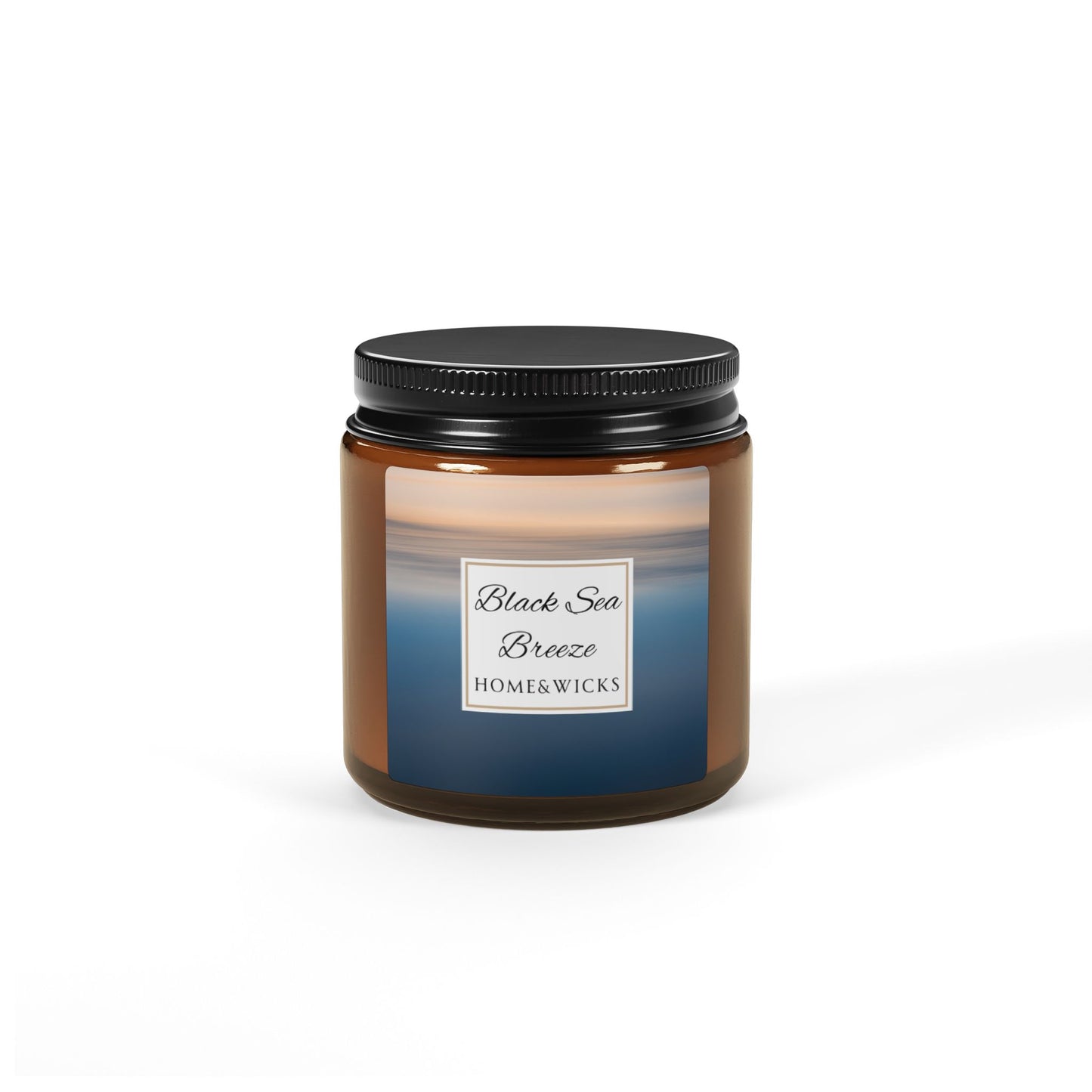 Candle jar labeled 'Black Sea Breeze' by Home & Wicks on a white background