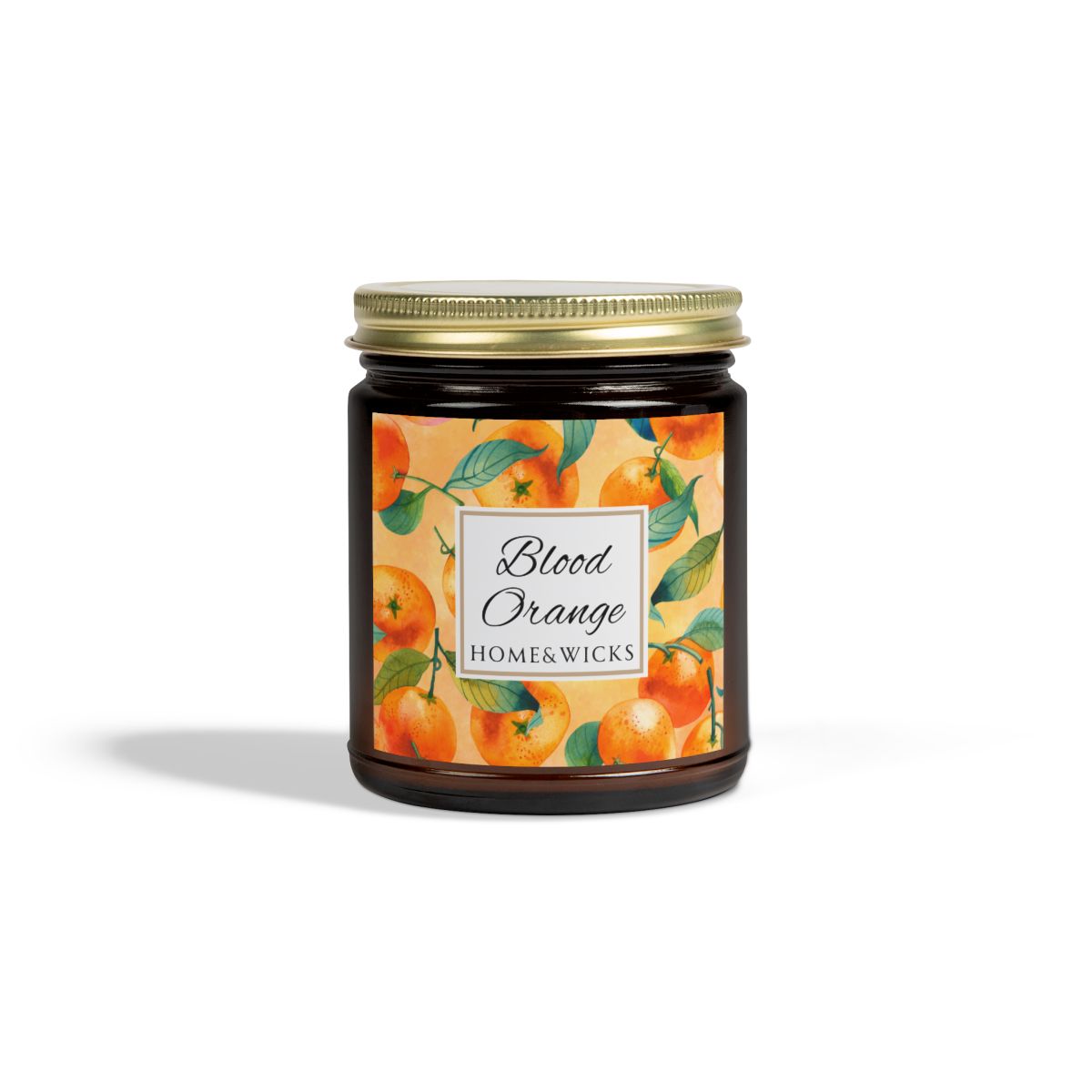 Blood Orange cotton wicked apricot coconut wax candle in an amber jar with gold lid and with 'Blood Orange' label and orange design on a white background by Home & Wicks