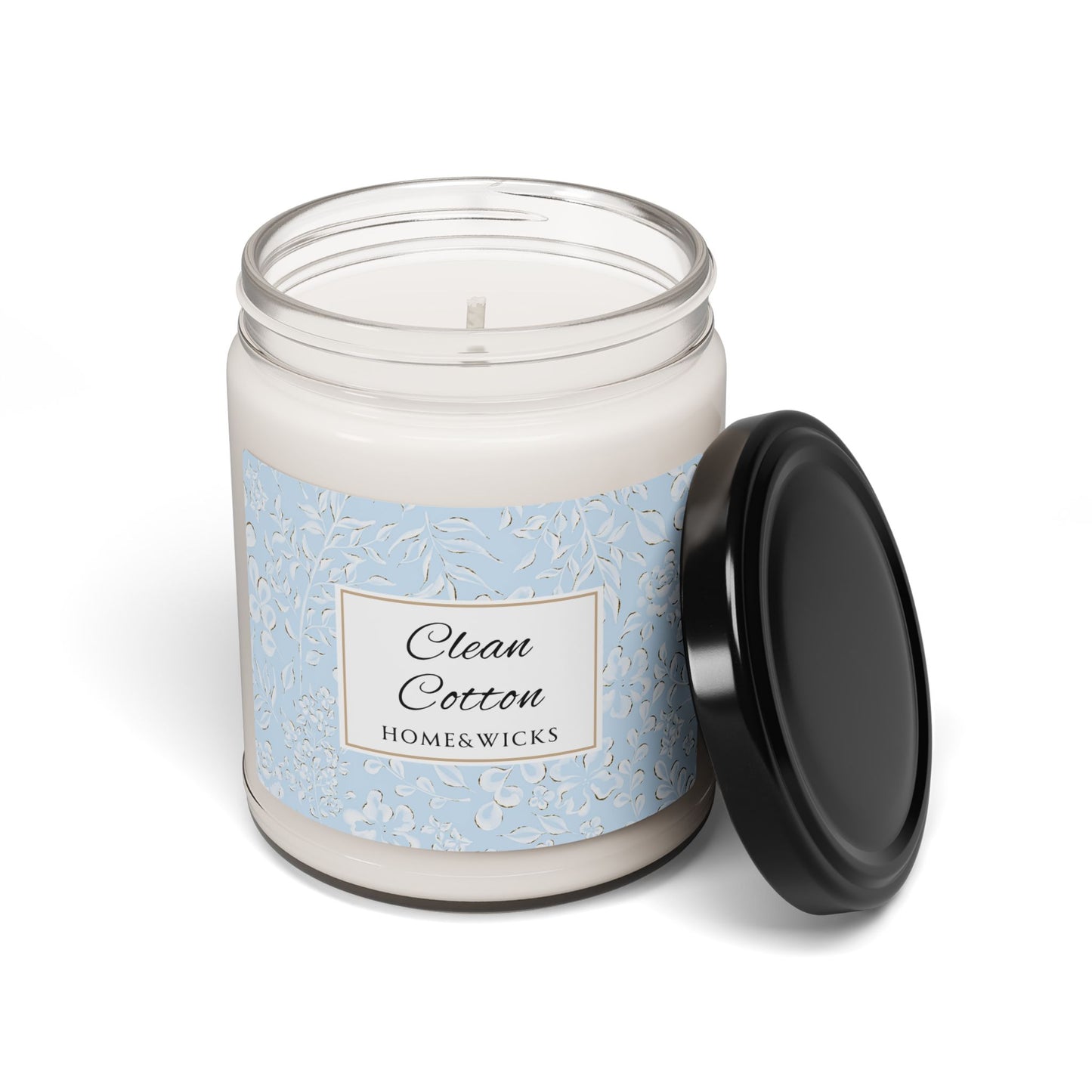 Candle jar labeled 'Clean Cotton' by Home & Wicks on a white background