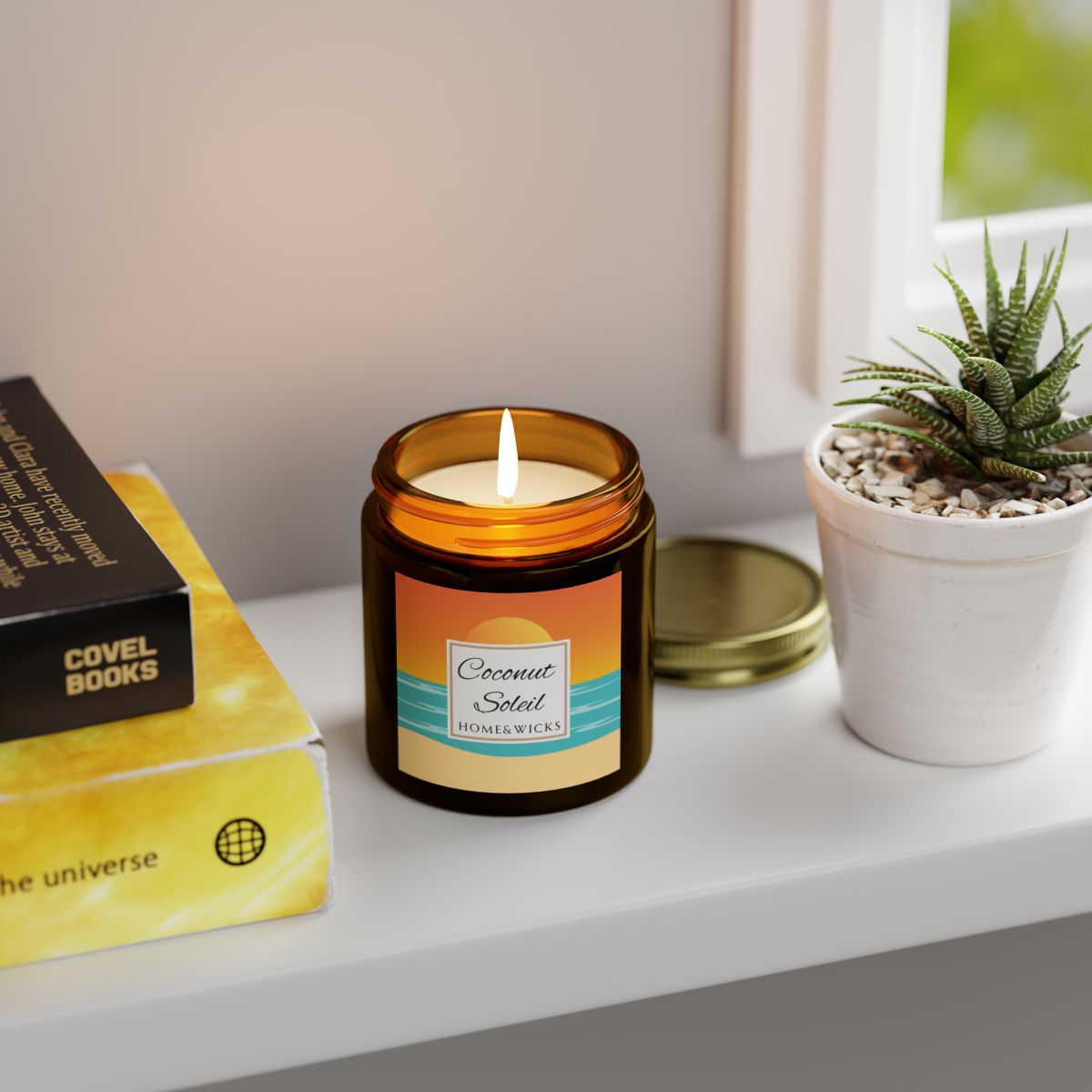 Coconut Soleil candle in 4 oz. amber glass jar with gold lid with a colorful sunset label on a white background by Home & Wicks on a shelf next to books and a plant