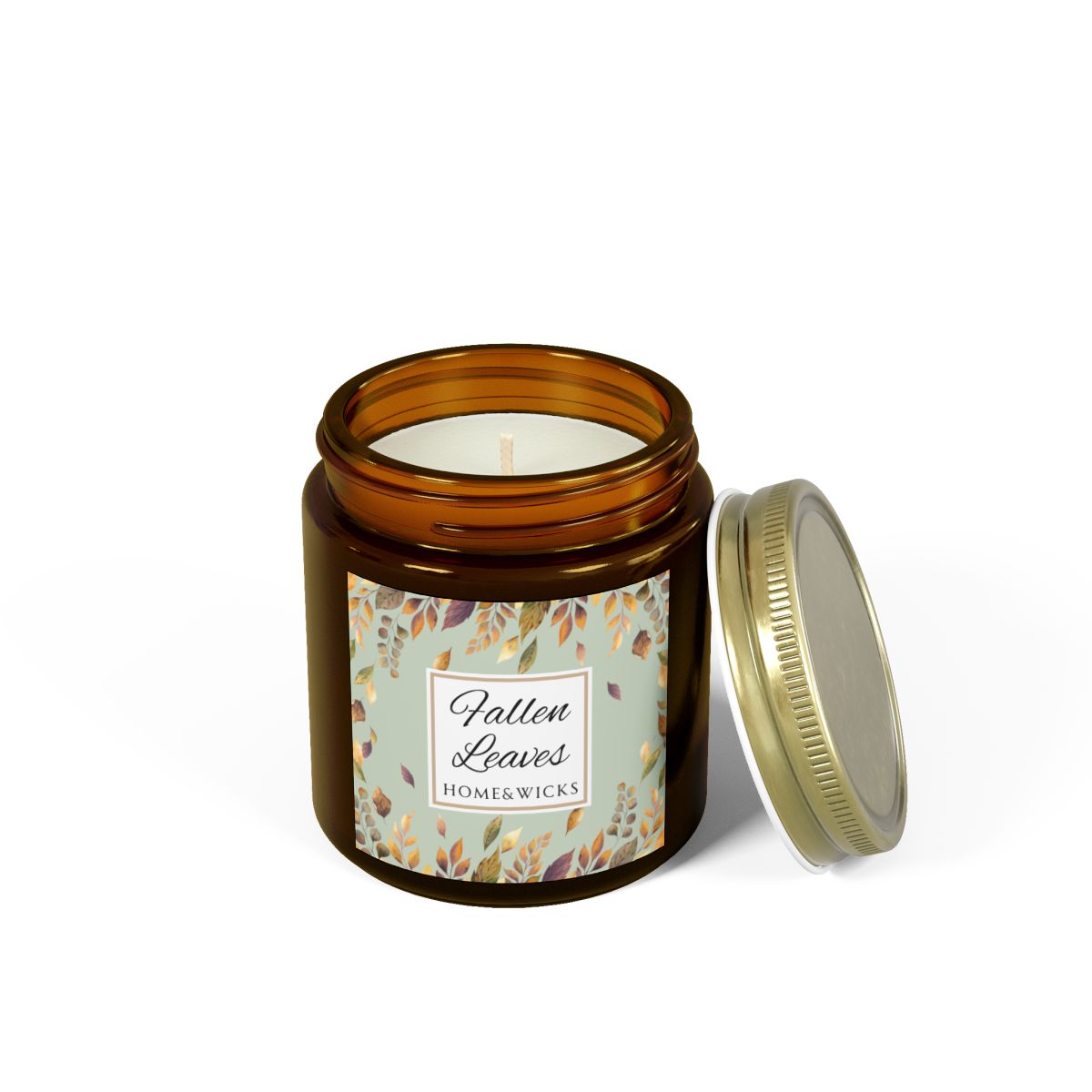 Fallen Leaves candle in a 4 oz. amber glass jar with gold lid with a 'Fallen Leaves' label on a white background by Home & Wicks