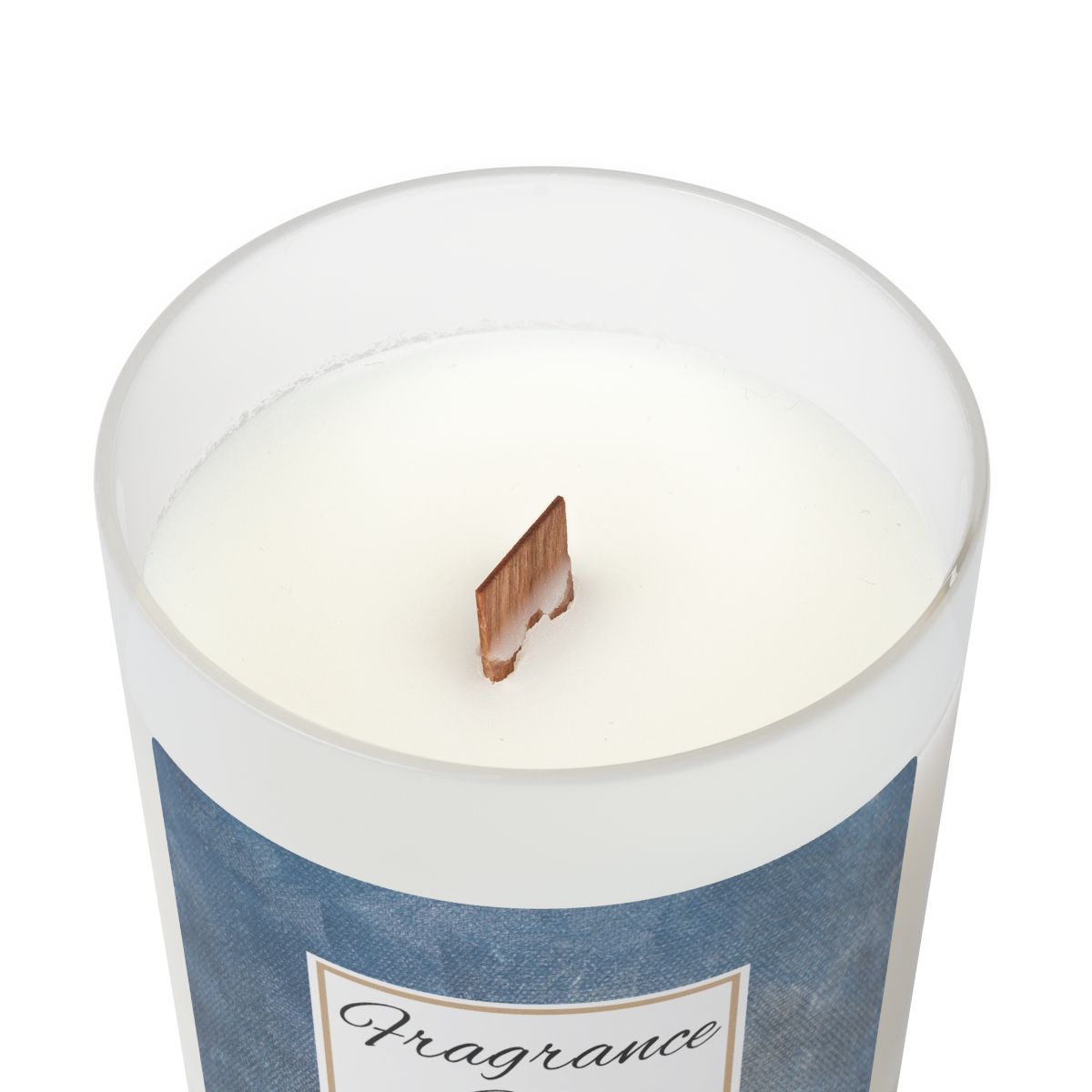 White candle in a blue cylindrical container with a wooden wick on a white background
