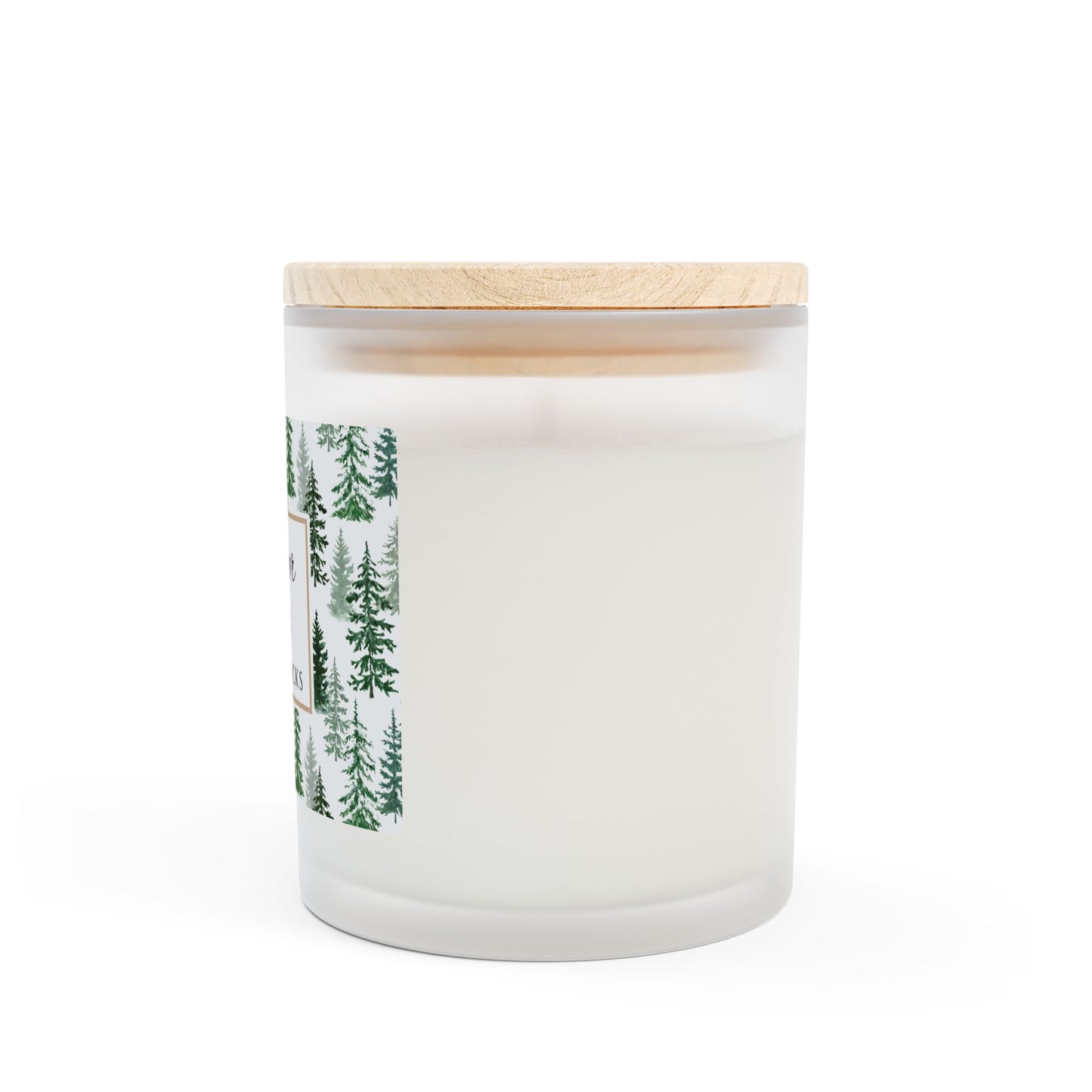 White candle with wooden lid and forest design on a white background