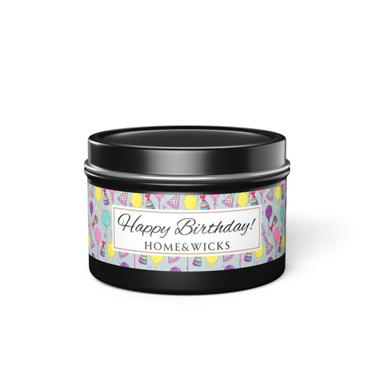 Black 4 oz. candle tin with 'Happy Birthday' label with colorful design of birthday hats, confetti and balloons on a white background