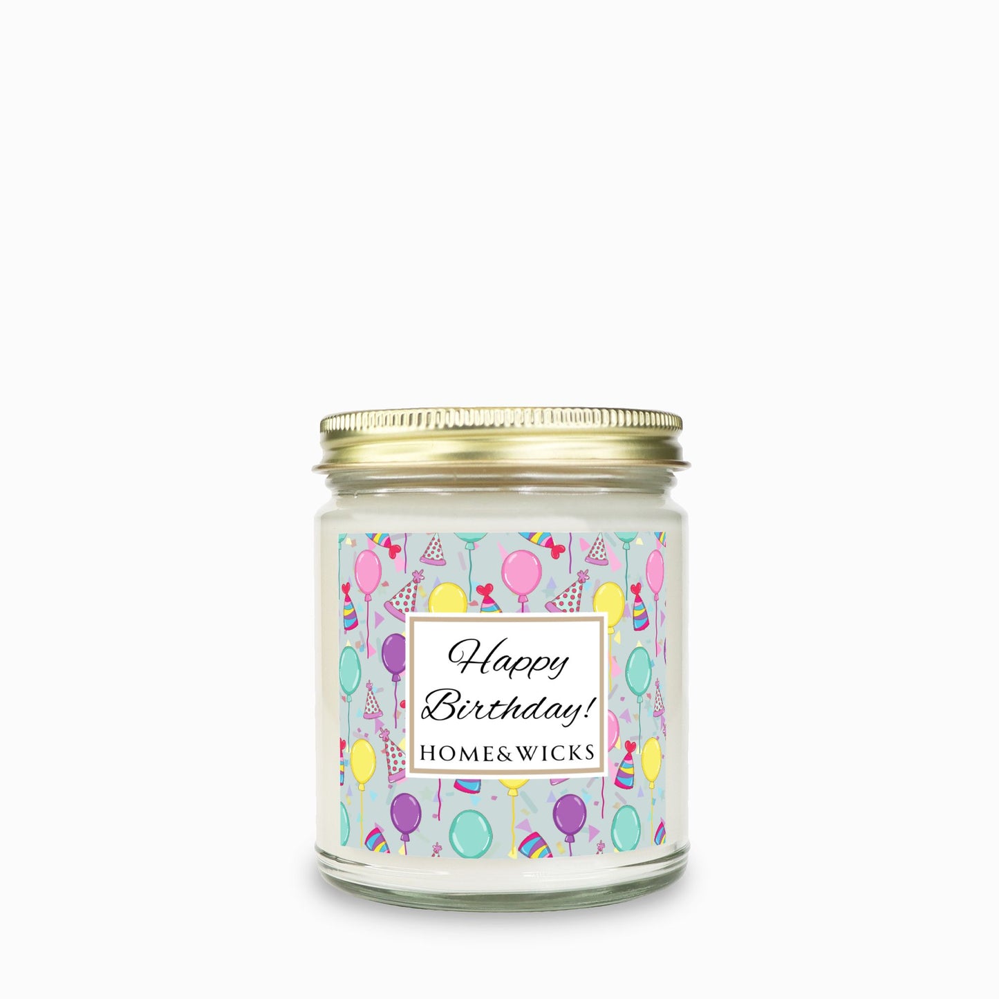 Candle in a clear jar with gold lid with a 'Happy Birthday!' with birthday hats, birthday balloons and confetti on label on a white background