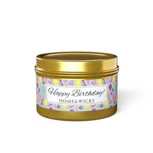 Happy Birthday gold 4 oz. candle tin with gold lid with a colorful label with birthday hats, balloons and confetti on a white background