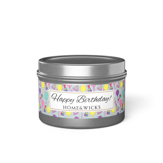 Happy Birthday silver candle 4 oz. tin with 'Happy Birthday' label with colorful design of birthday hats, balloons and confetti on a white background
