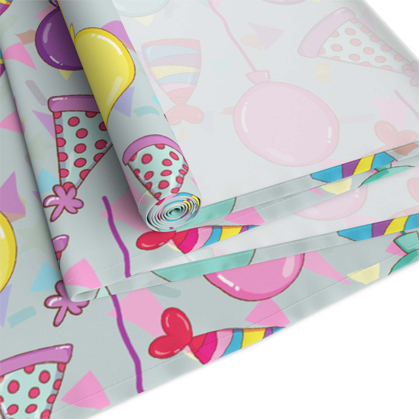 Table runner with colorful birthday party hats, confetti and balloons pattern on a white background