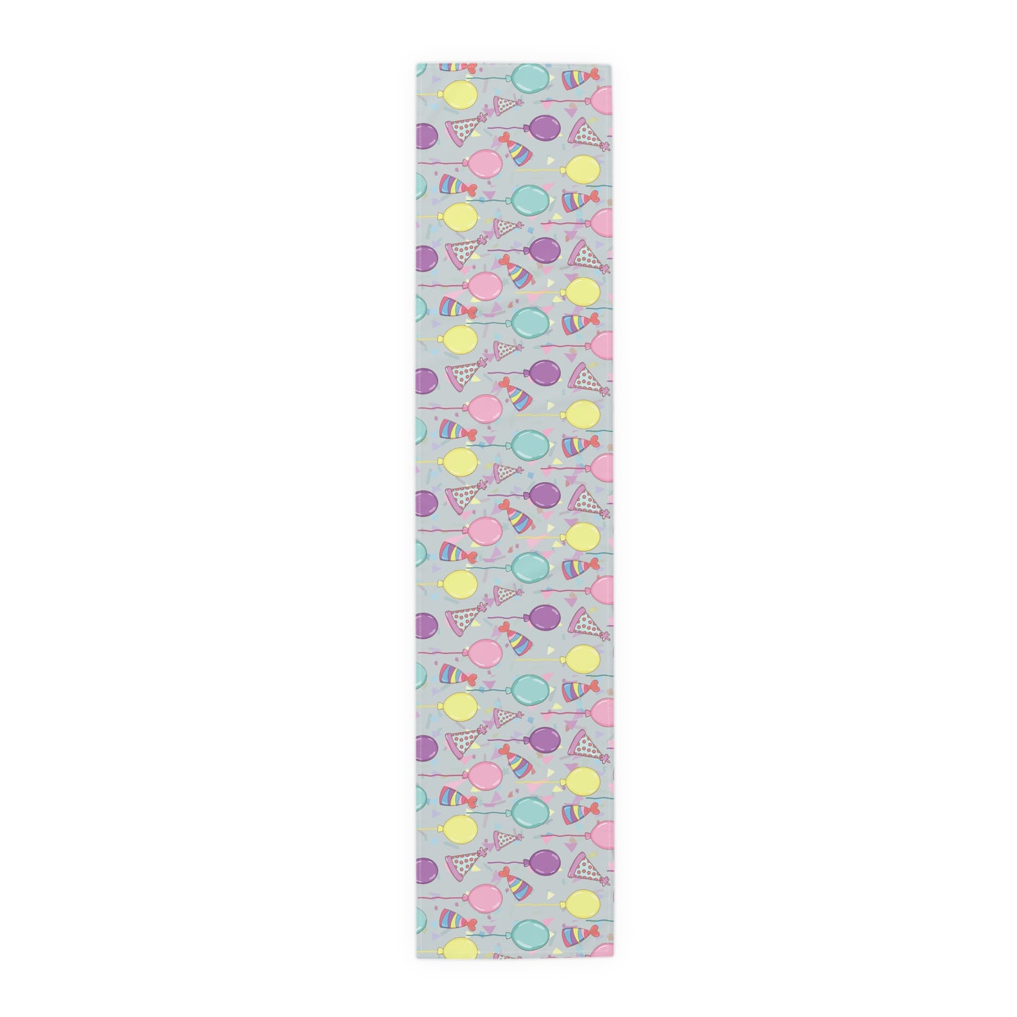 Table runner with colorful birthday party hats, confetti and balloons pattern on a light gray background
