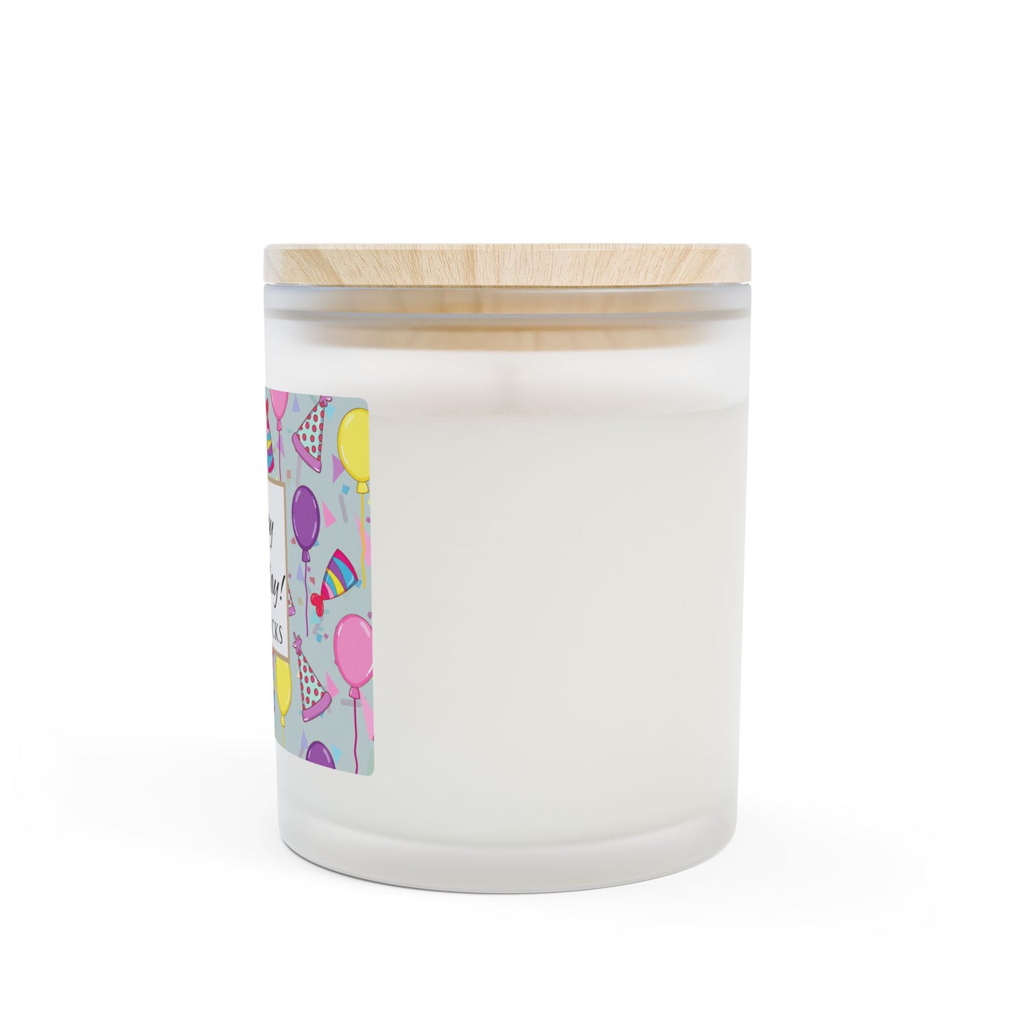 Side view of Wood wick candle with a 'Happy Birthday' label featuring balloons and party hats with maple wood lid on a white background.