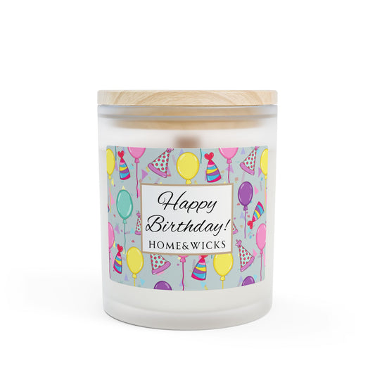 Wood wick candle with a 'Happy Birthday' label featuring balloons and party hats with maple wood lid on a white background.