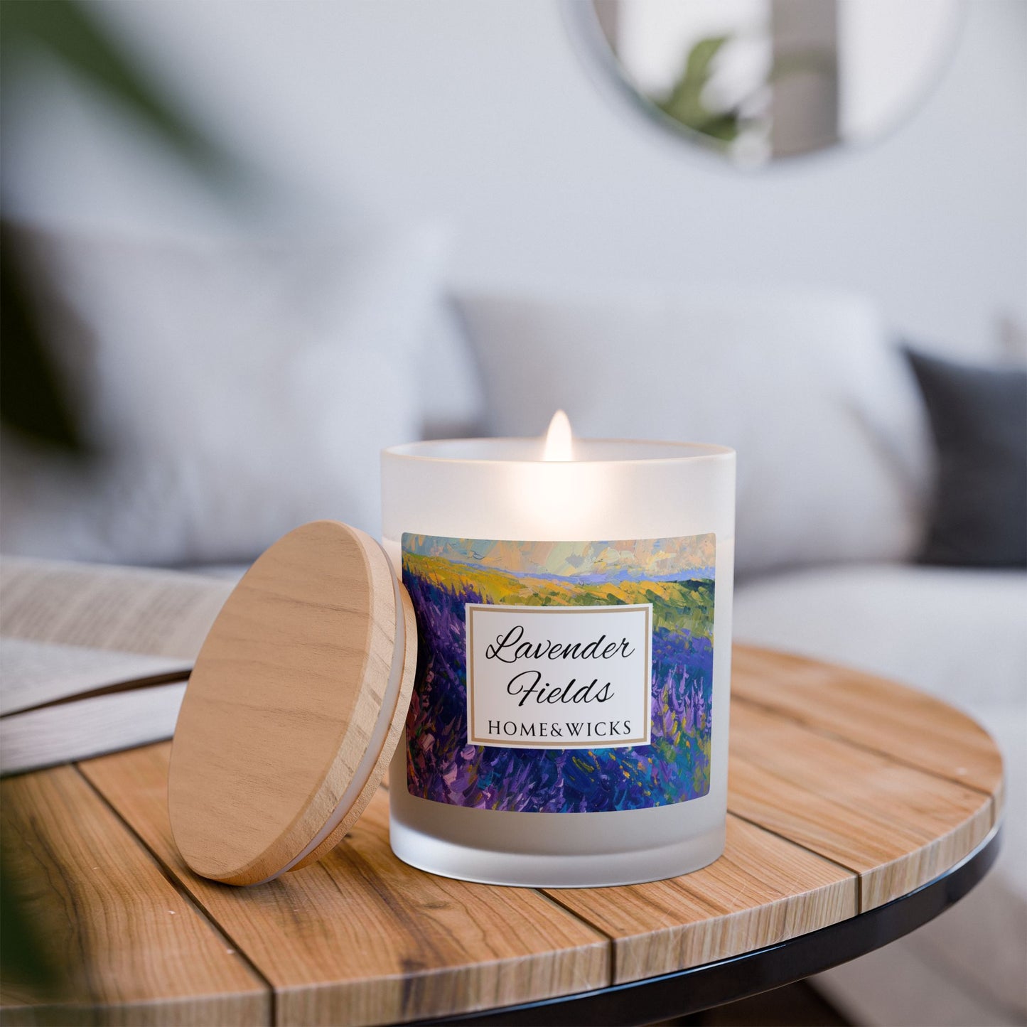Candle labeled 'Lavender Fields' by Home & Wicks on a wooden table with a blurred background