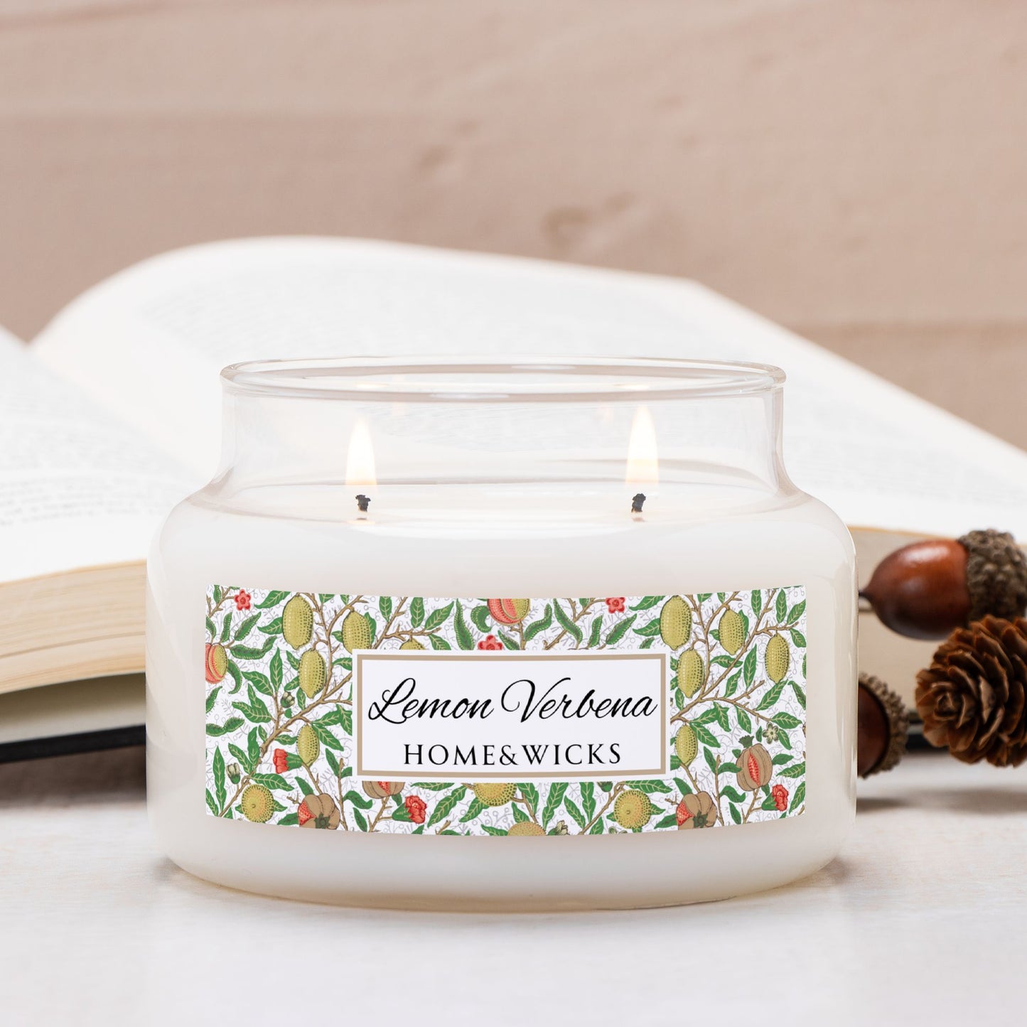 Candle in a glass apothecary jar with a decorative label on a light background