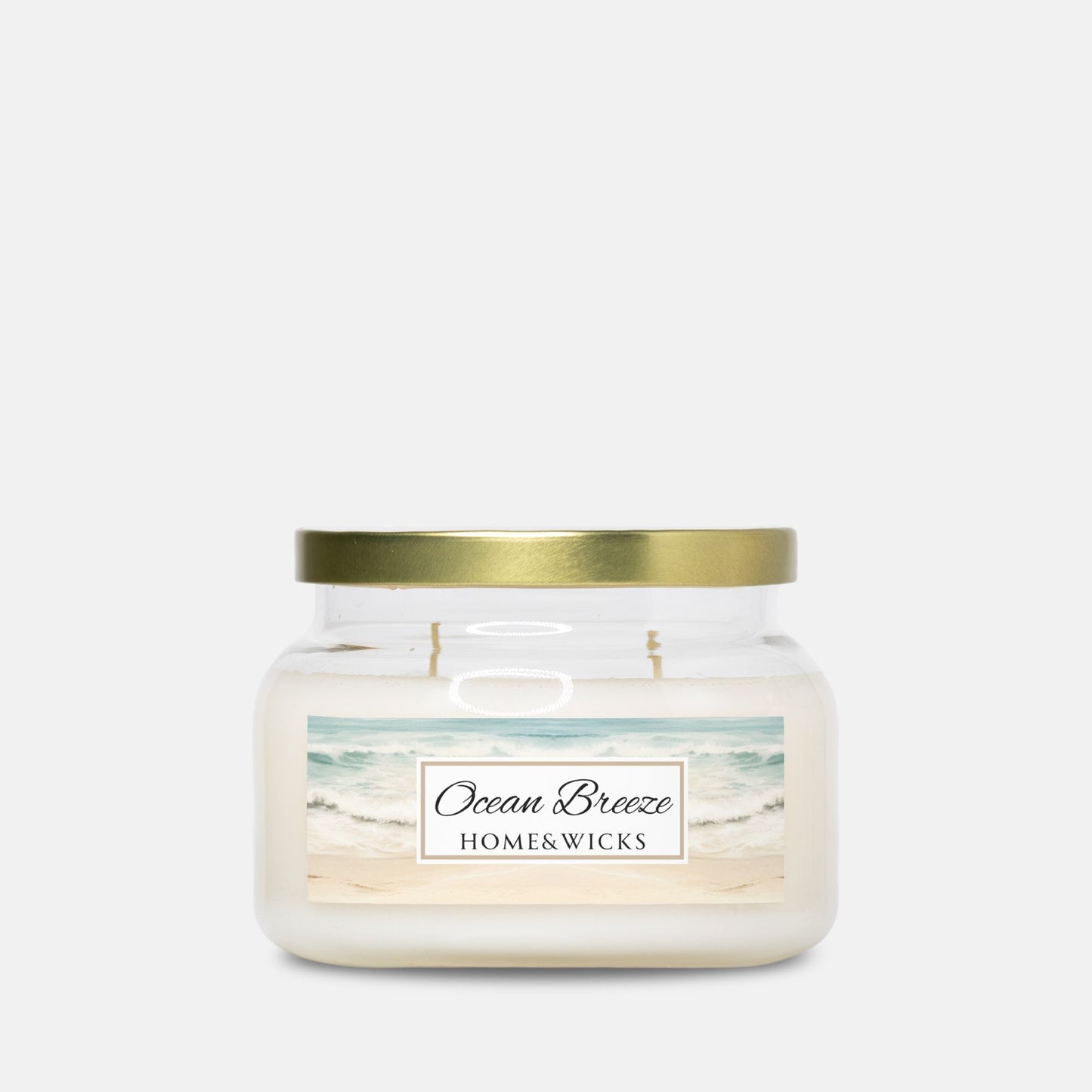 Double wicked apothecary candle jar labeled 'Ocean Breeze' by Home & Wicks on a white background w