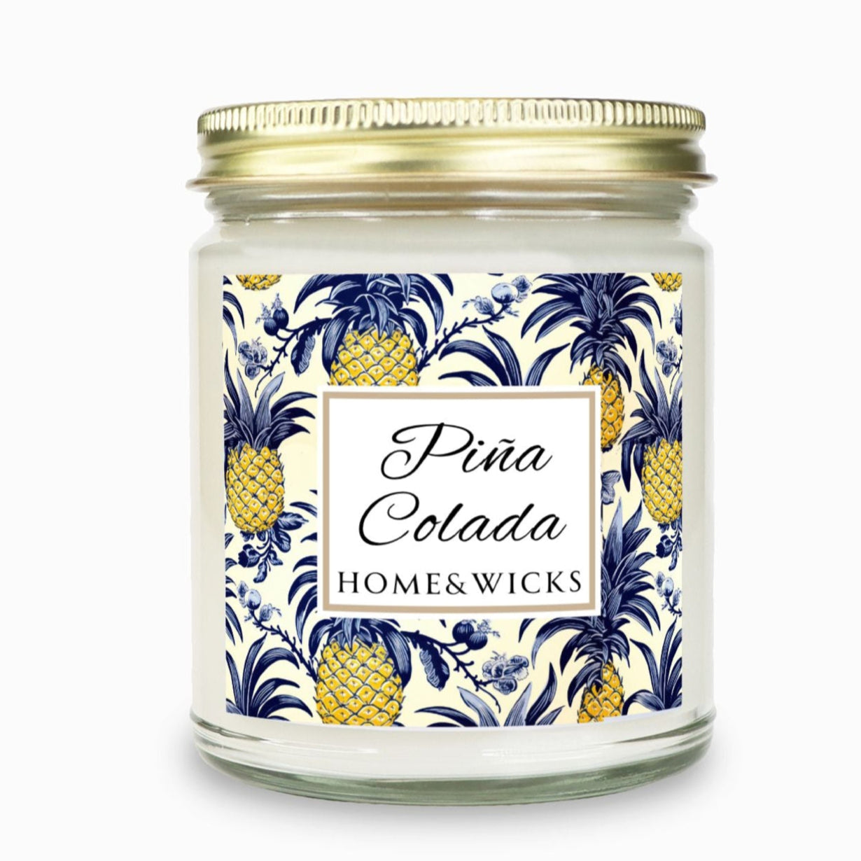 Clear candle jar with gold lid with pineapple design and 'Pina Colada' Home & Wicks' label on a white background
