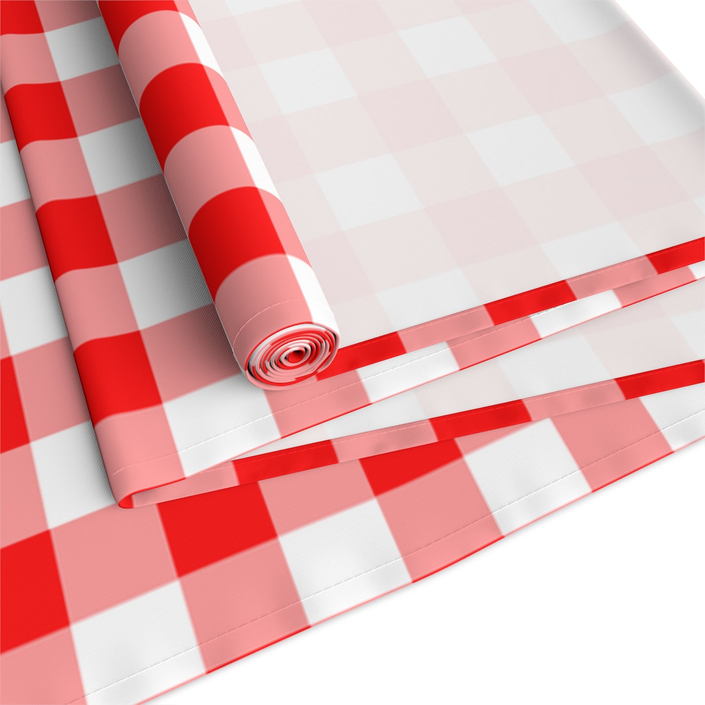 Rolled and folded  red and white gingham checkered table runner on a white background