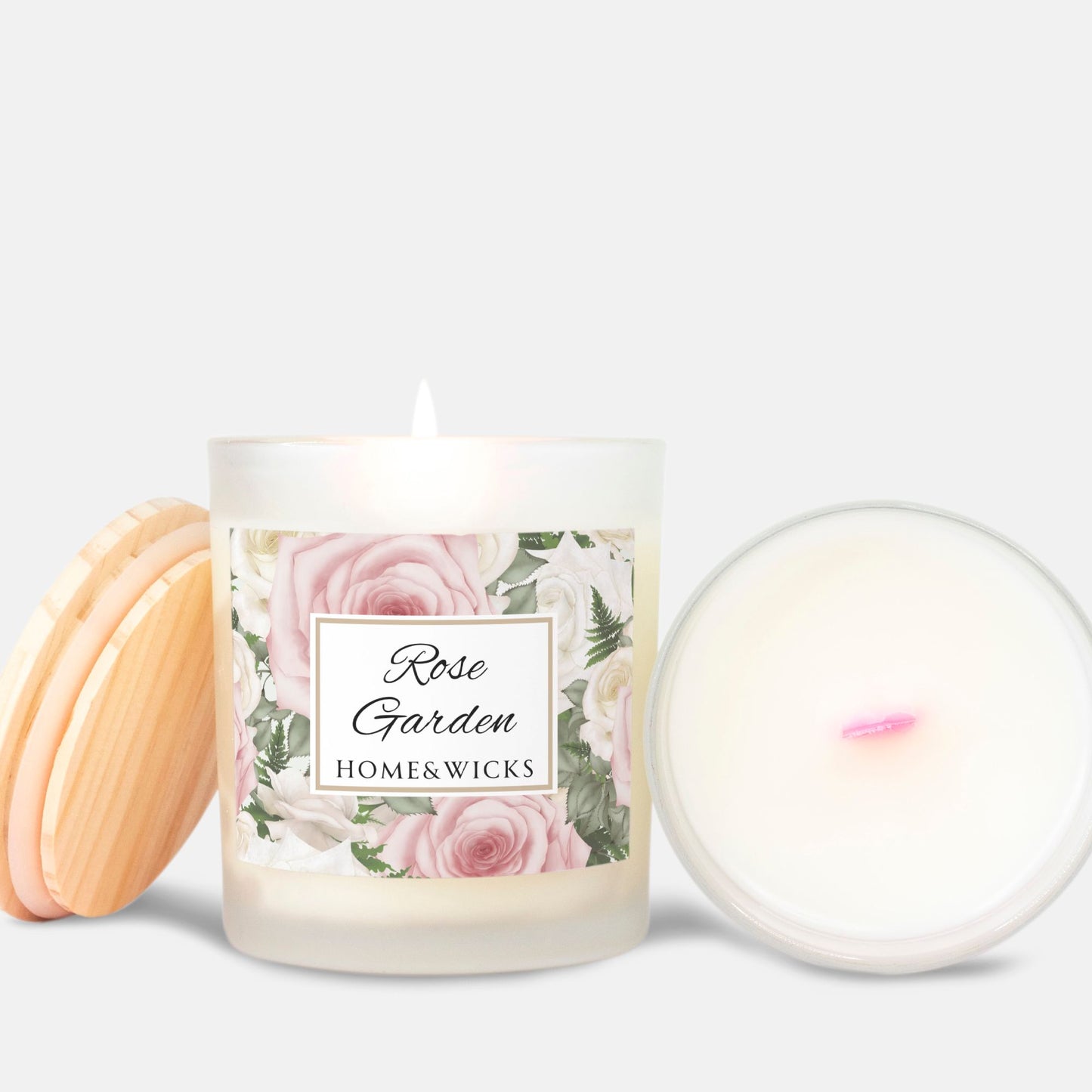 Candle with 'Rose Garden' label with pink wood wick and wooden coaster on a white background