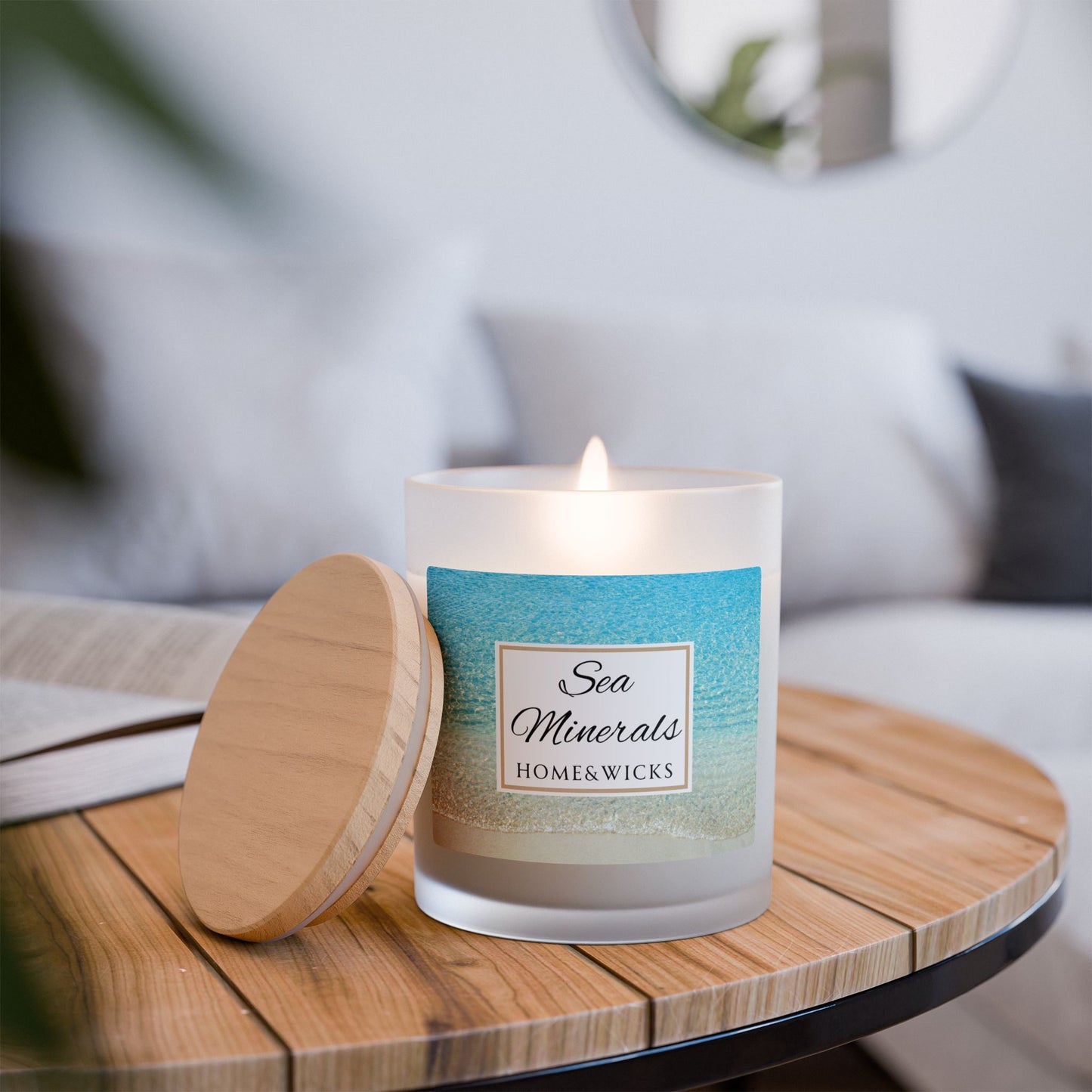 Candle with a label on a wooden table, Sea Minerals blurred background