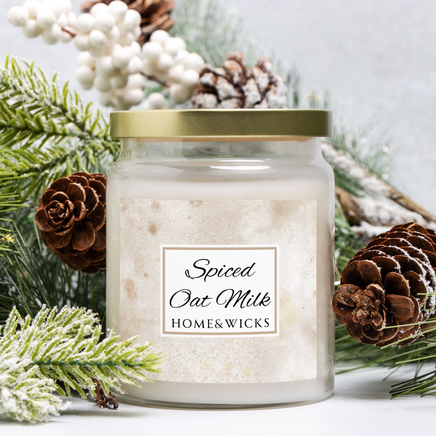 Candle jar labeled 'Spiced Oat Milk' by Home & Wicks with decorative elements on a light background