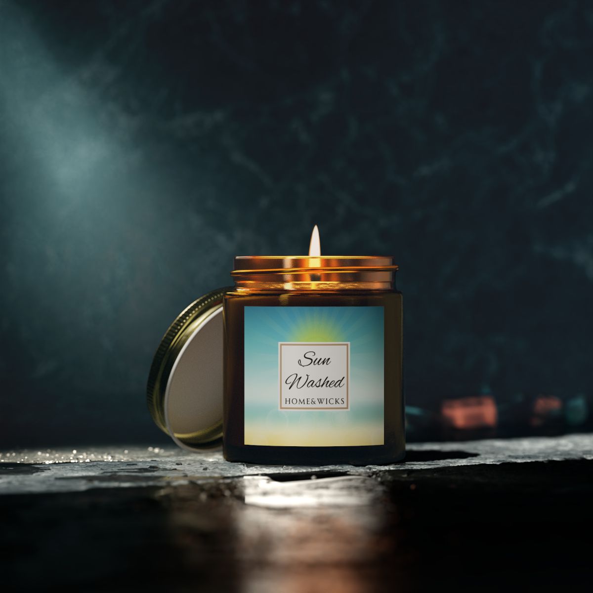 Sun Washed candle in a 4 oz. jar labeled 'Sun Washed' with sun graphic by Home & Wicks on a white background on a dark background