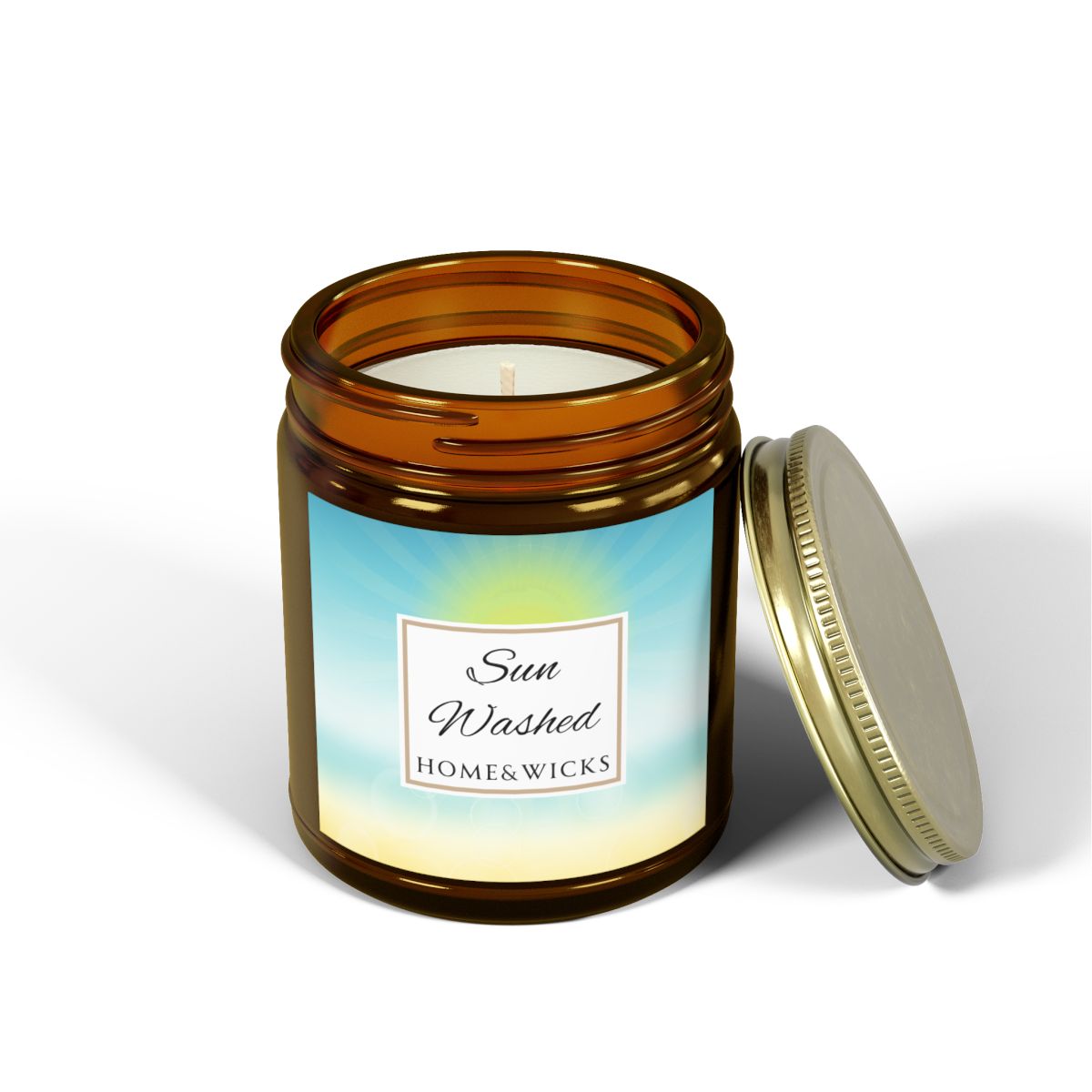 Candle in a 9 oz. amber jar with gold lid with 'Sun Washed' label on with sun graphic gradient background by Home & Wicks