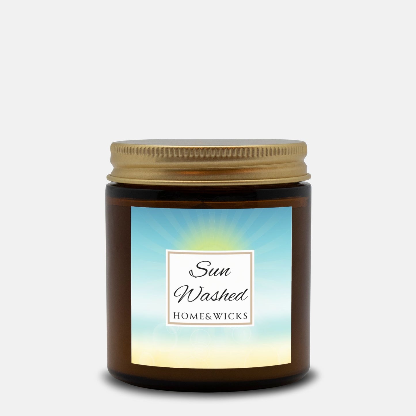 Sun Washed candle in a 4 oz. jar labeled 'Sun Washed' with sun graphic by Home & Wicks on a white background