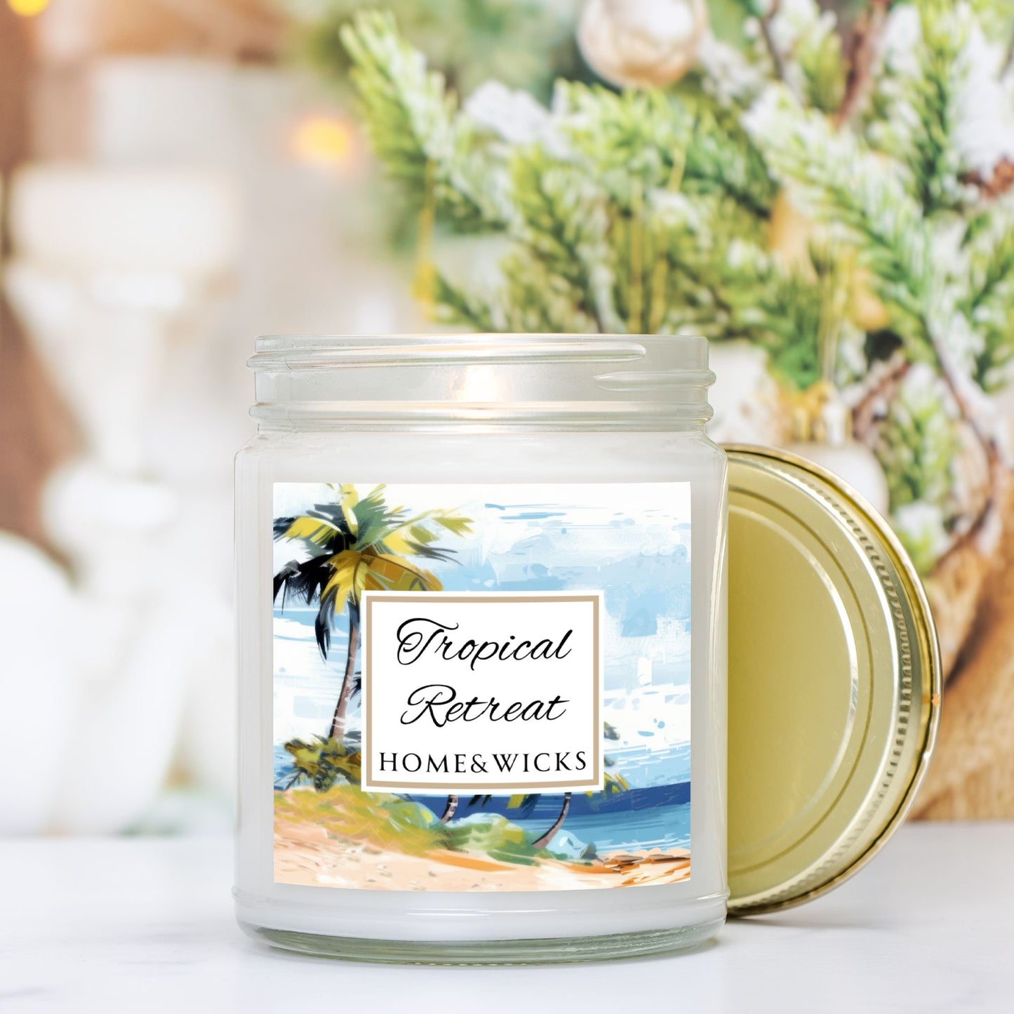 Tropical Retreat clear jar candle with gold lid labeled 'Tropical Retreat' with tropical beach seashore by Home & Wicks on a white background with a beach scene design.