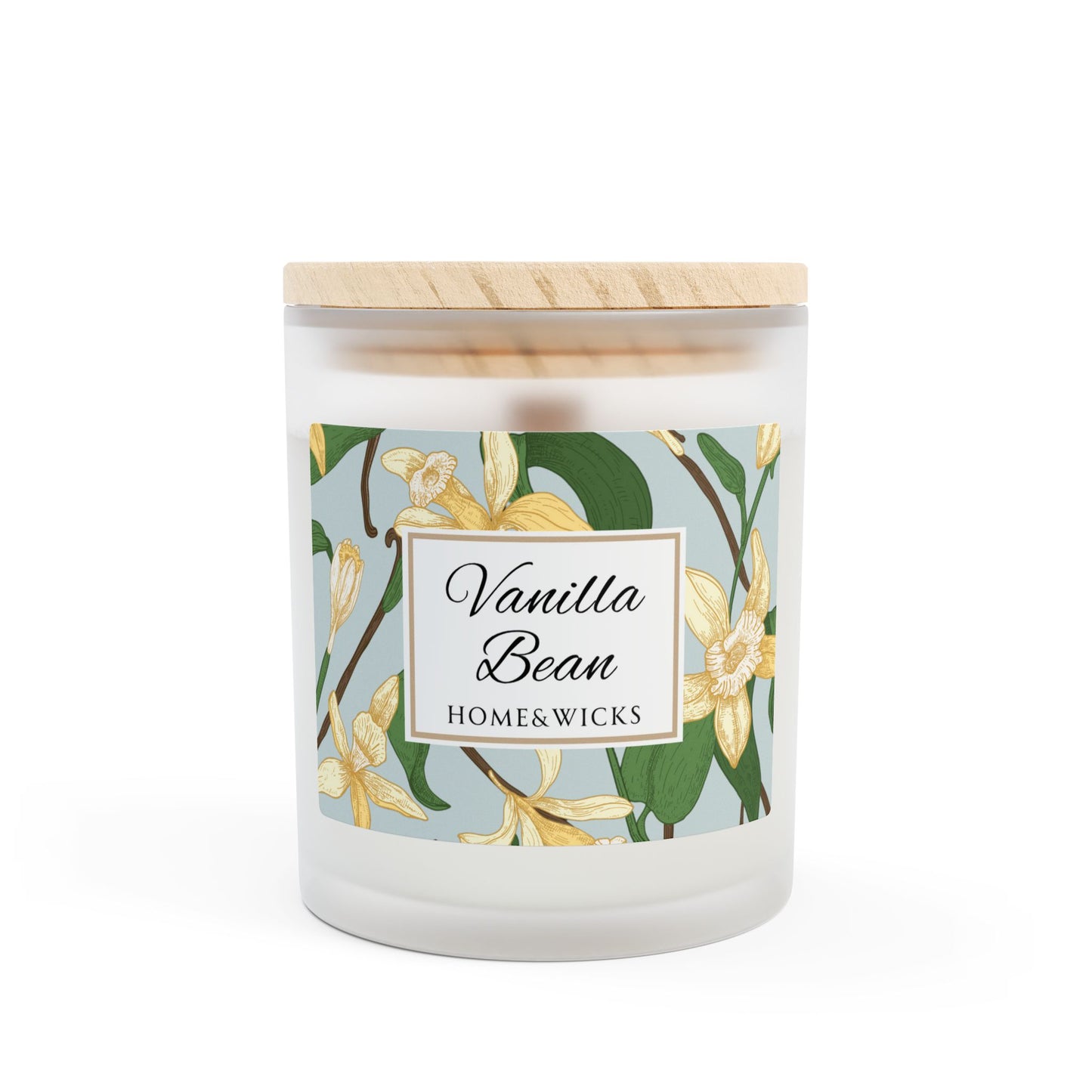 Candle with 'Vanilla Bean' label and floral design on a white background