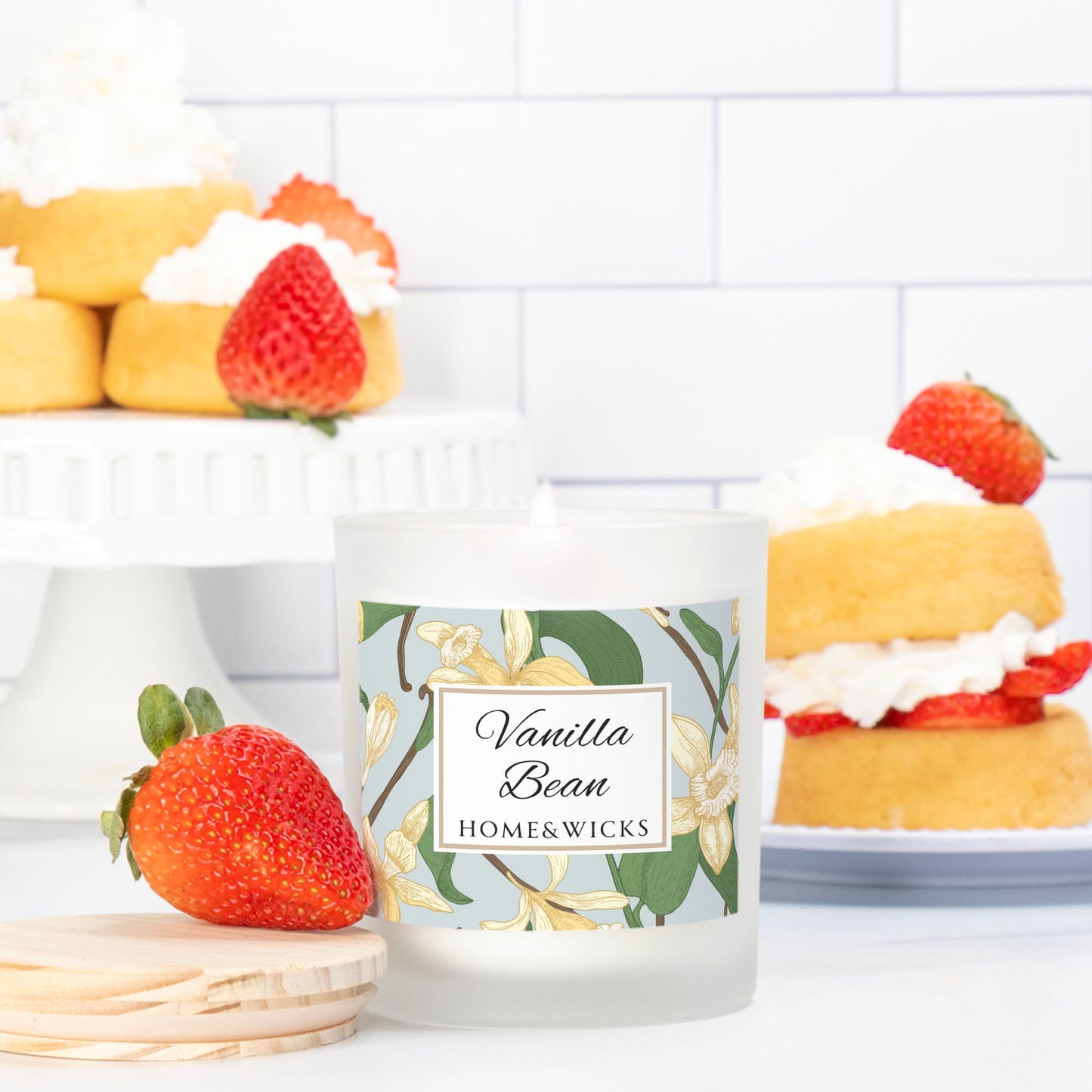 Vanilla Bean candle with strawberry and cake decorations on a white background
