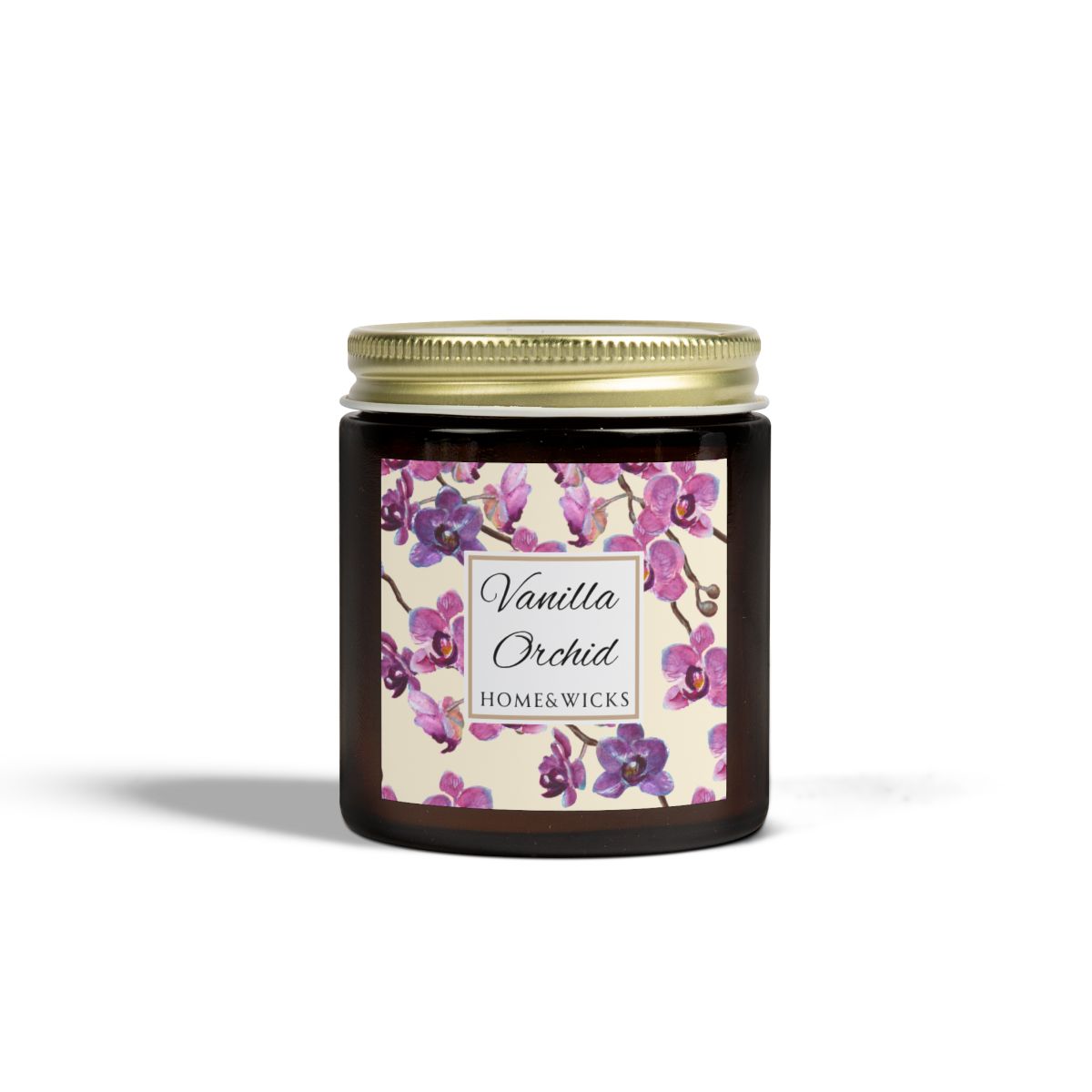 Vanilla Orchid candle in a 4 oz. amber glass candle jar with gold lid with a pink and purple orchid floral label on a white background by Home & Wicks