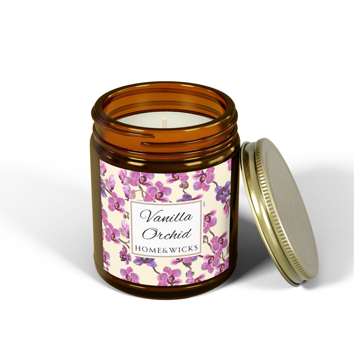 Vanilla Orchid candle in an amber jar with gold lid with a pink and purple orchid design label by Home & Wicks on a white background