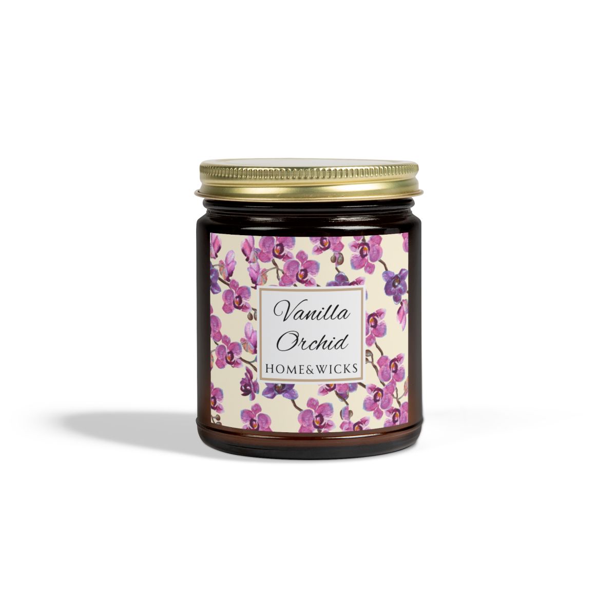 Vanilla Orchid candle in an amber jar with gold lid with a pink and purple orchid design label by Home & Wicks on a white background