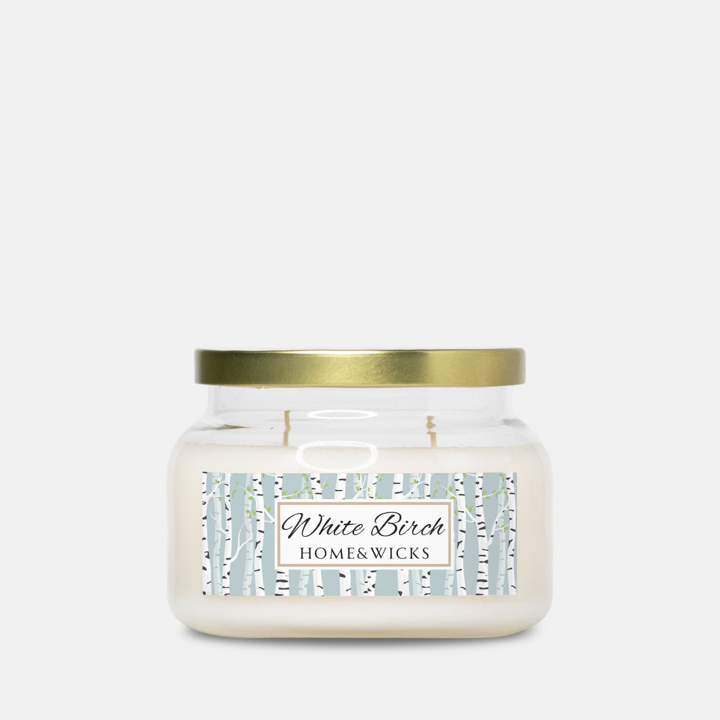 Apothecary candle jar with gold lid and 'White Birch Home & Wicks' label on a white background