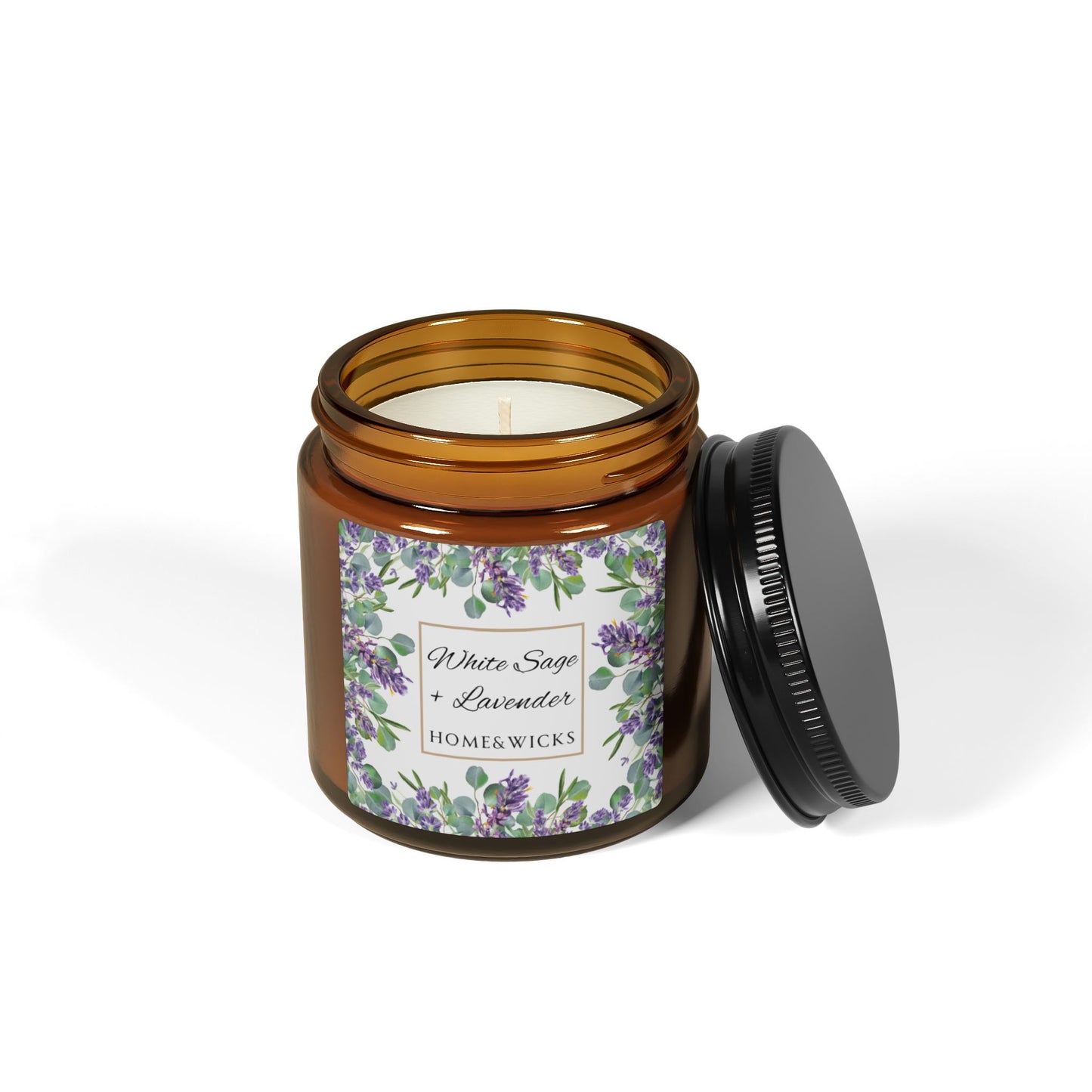 Candle in an amber jar with a floral label on a white background