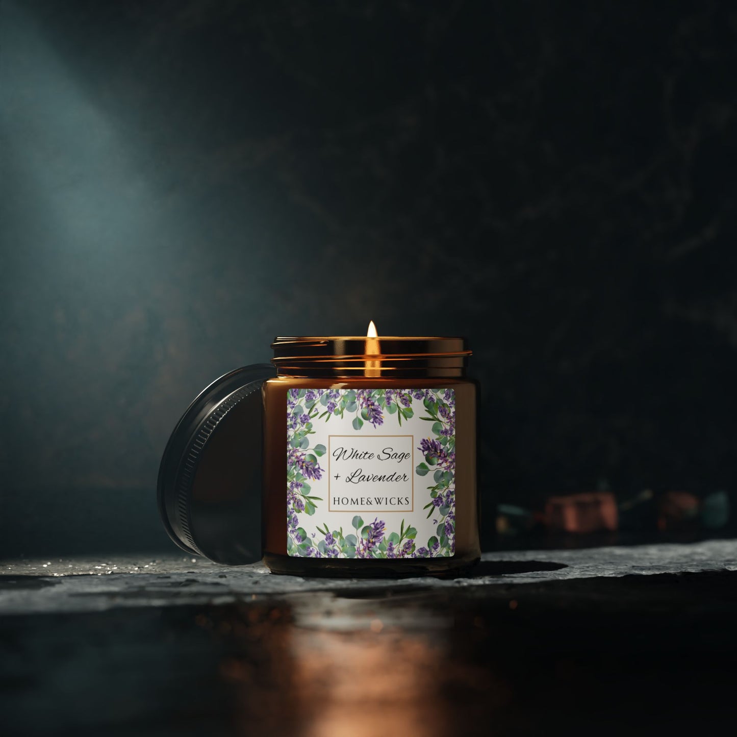 Candle in a jar with a floral label on a dark background