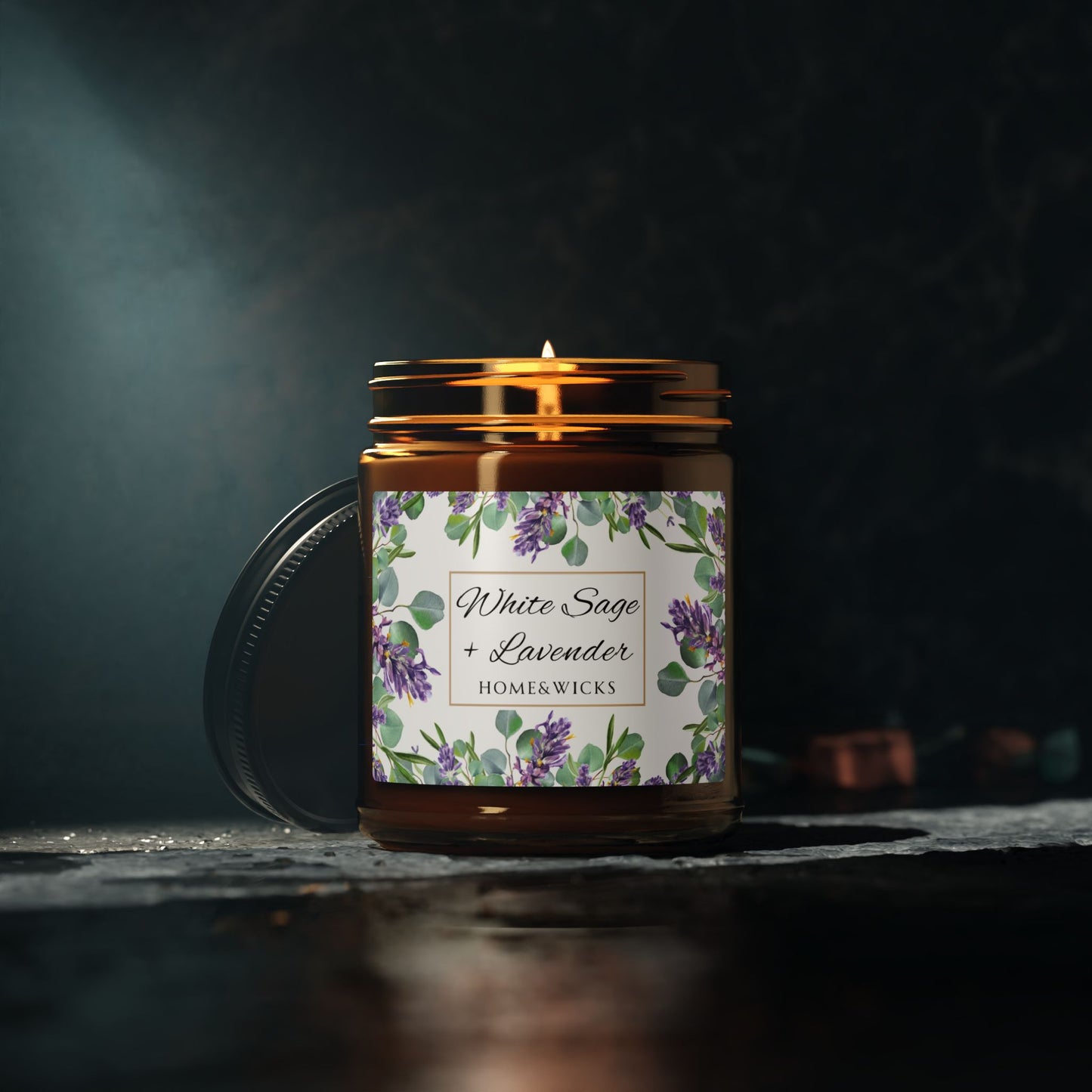 Homer & Wicks candle with floral label on a dark background