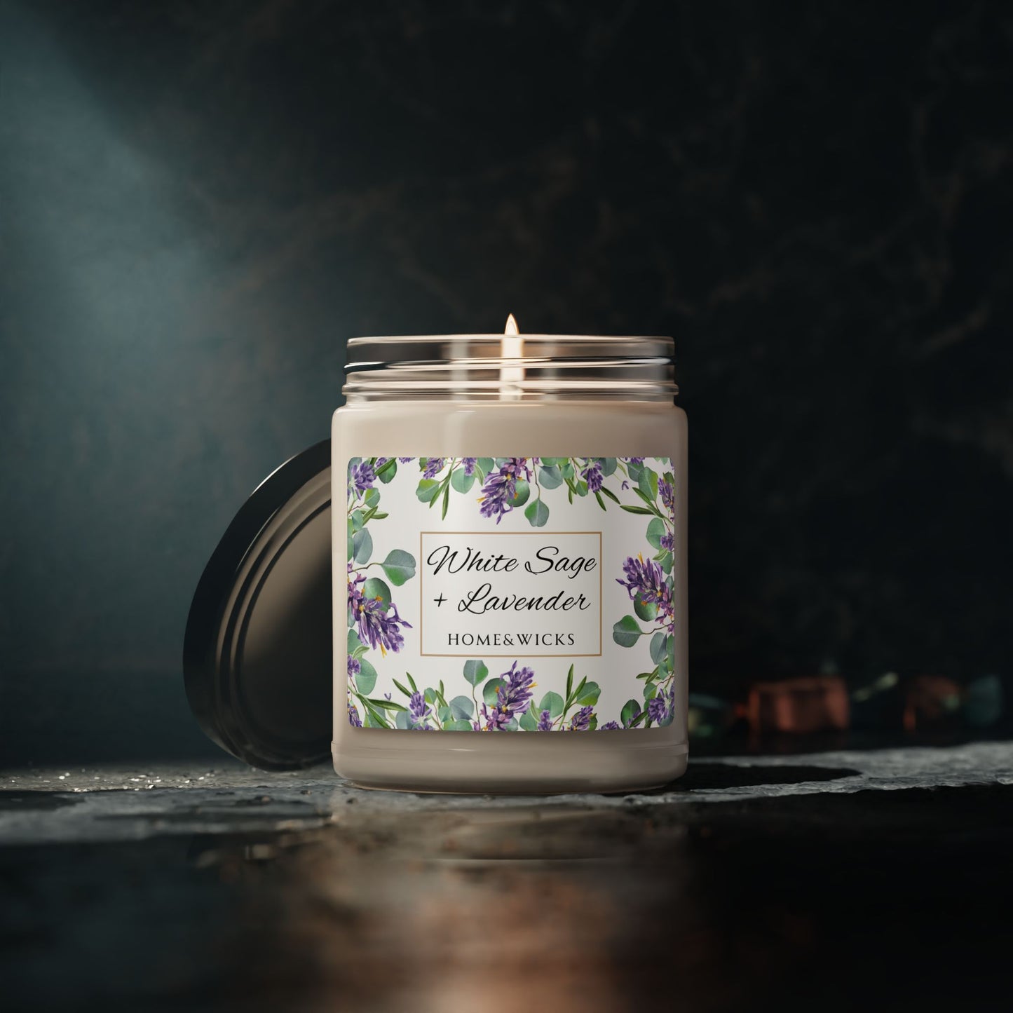 Home and wikes candle with a floral label on a dark background