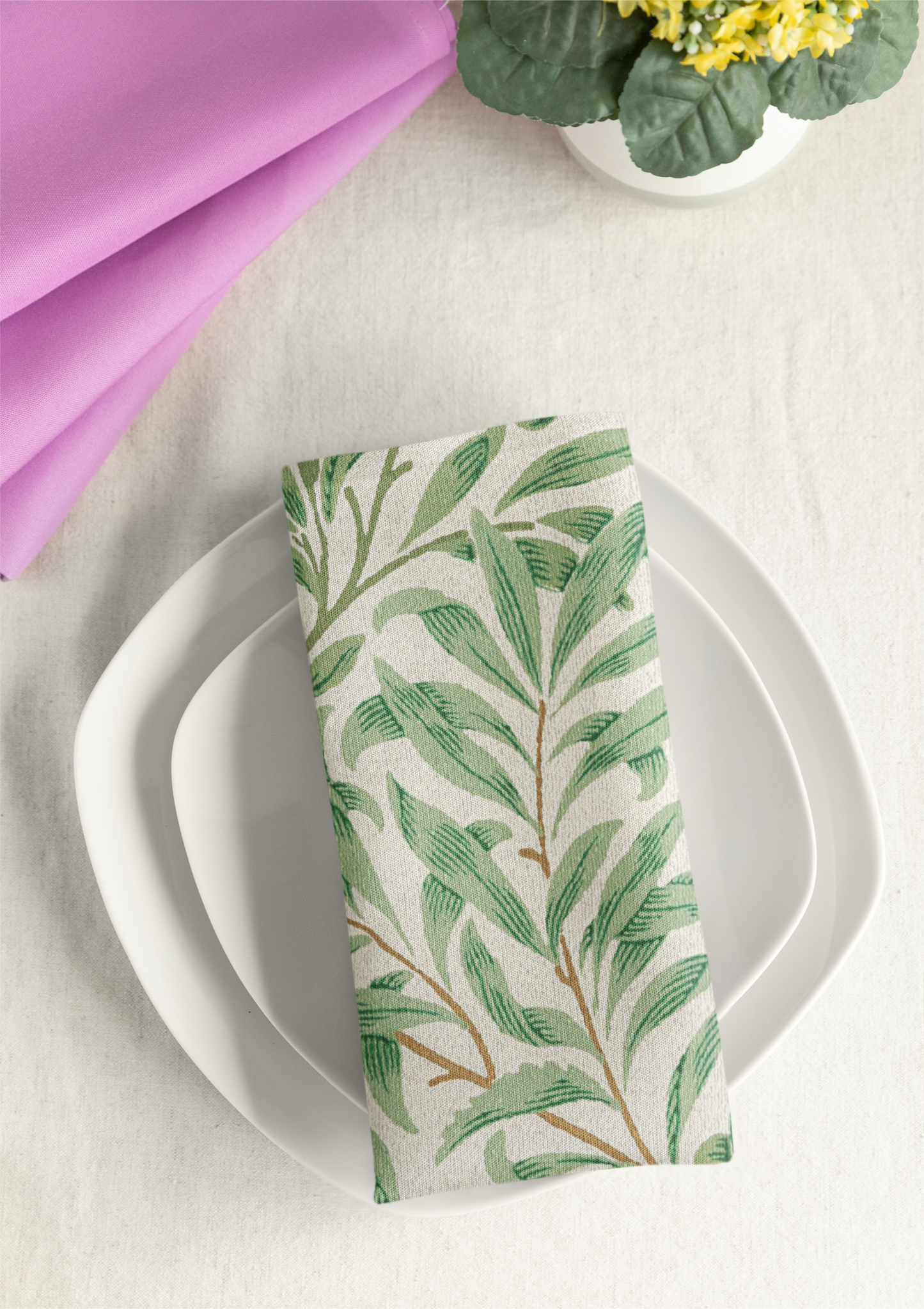 Willow Boughs 22 x 22 Napkin with green leaf willow branch pattern on a white plate