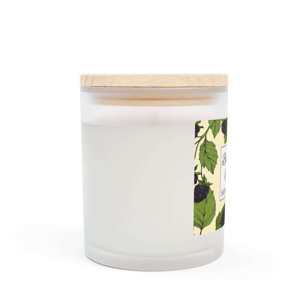 Side view of wood wick Blackberry Vanilla candle with a label featuring blackberries and leaves image on a white background by Home & Wicks