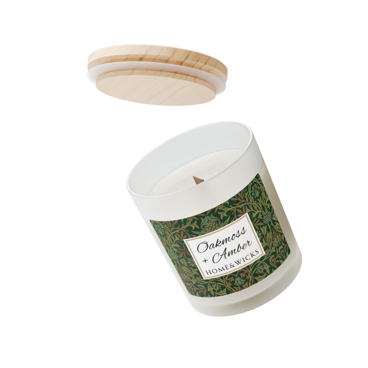 Wood wick Oakmoss & Amber candle in a frosted glass jar with a green decorative label featuring the illustration by William Morris "Flower Garden" on a white background by Home & Wicks