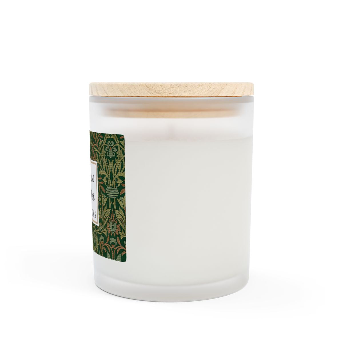Side view of wood wick Oakmoss & Amber candle in a frosted glass jar with a green decorative label featuring the illustration by William Morris "Flower Garden" on a white background by Home & Wicks