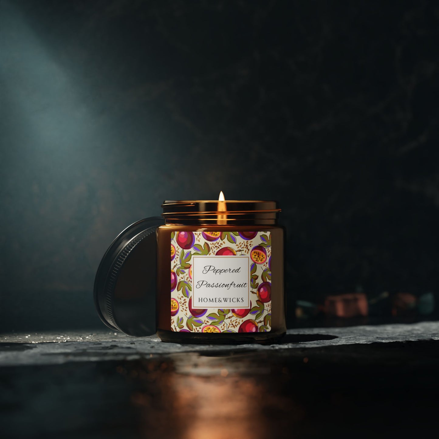 Candle in a decorative jar with a colorful label on a dark background