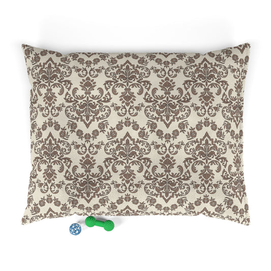 Decorative Baroque Mocha dog pet bed pillow with brown floral pattern on a beige background, with a small blue and green toy at the bottom.