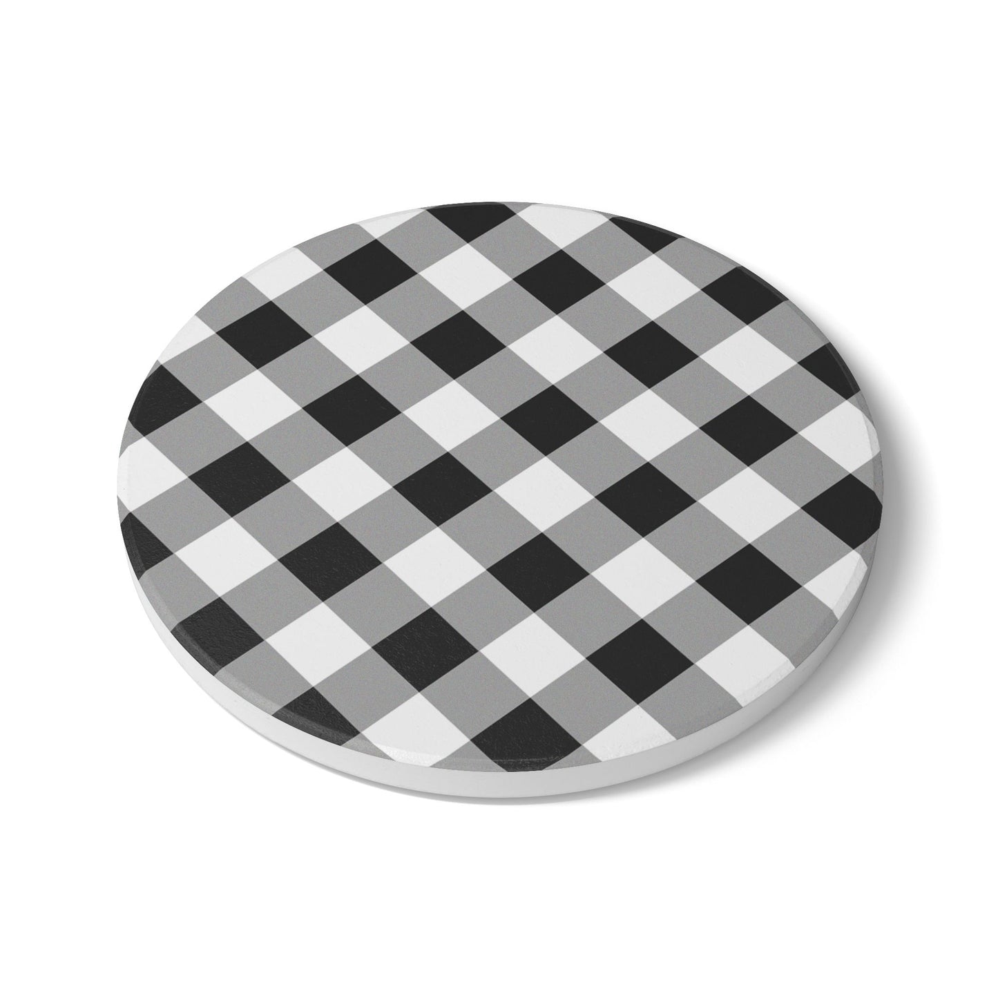 Round coaster with checkered black and white gingham patterned tile coaster on a white background