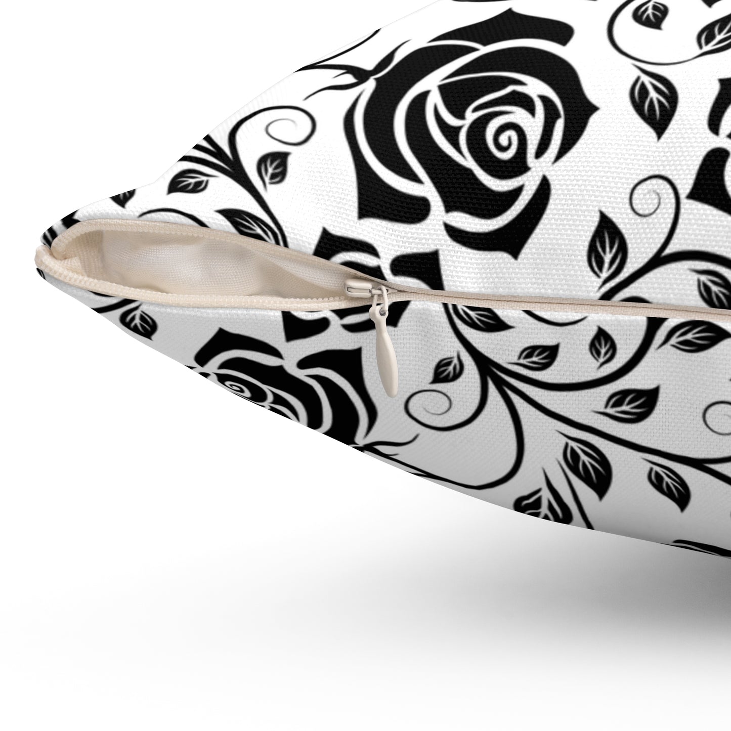 Pillow with black rose pattern with zipper closure on a white background