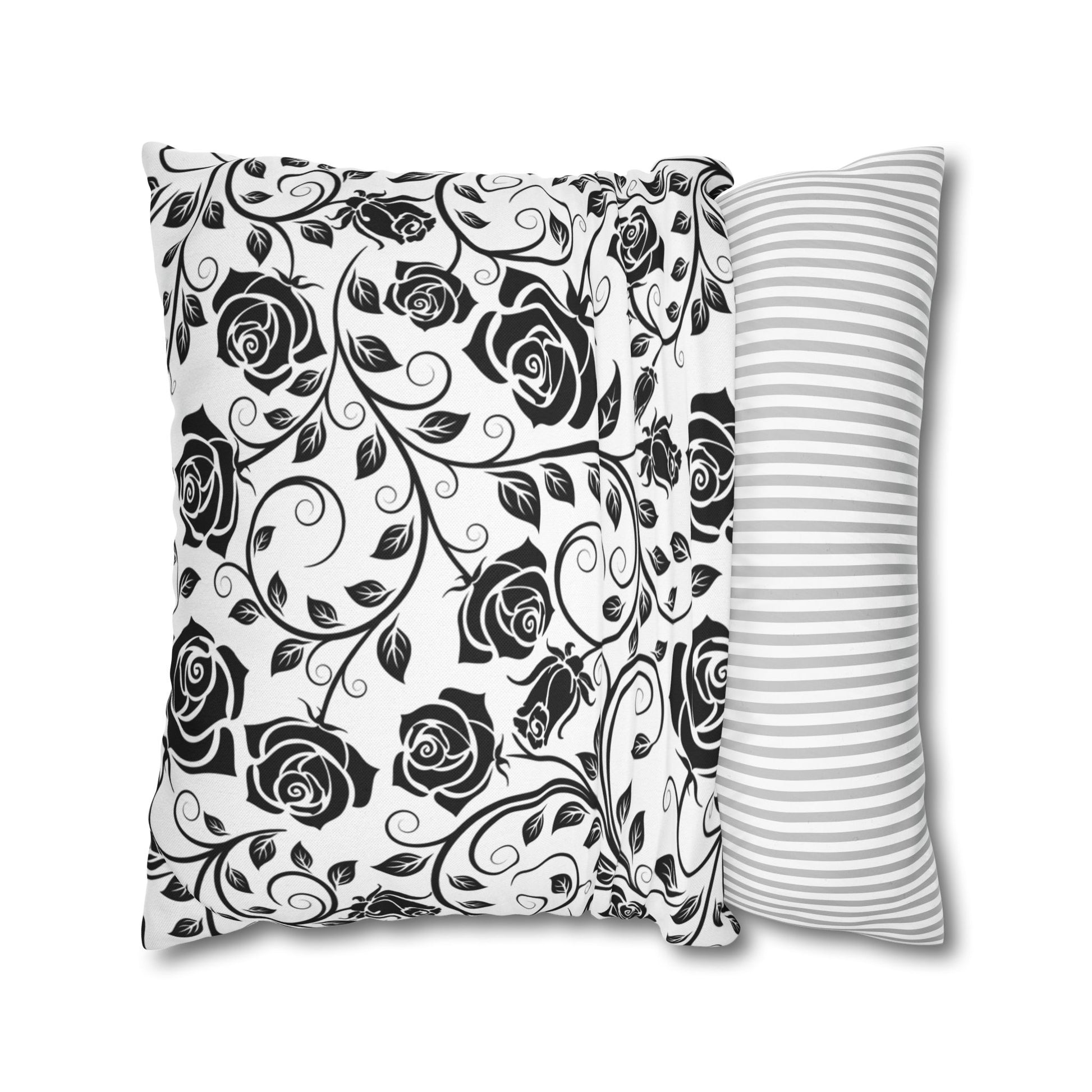 Black and white rose pattern square pillowcase on a white background.