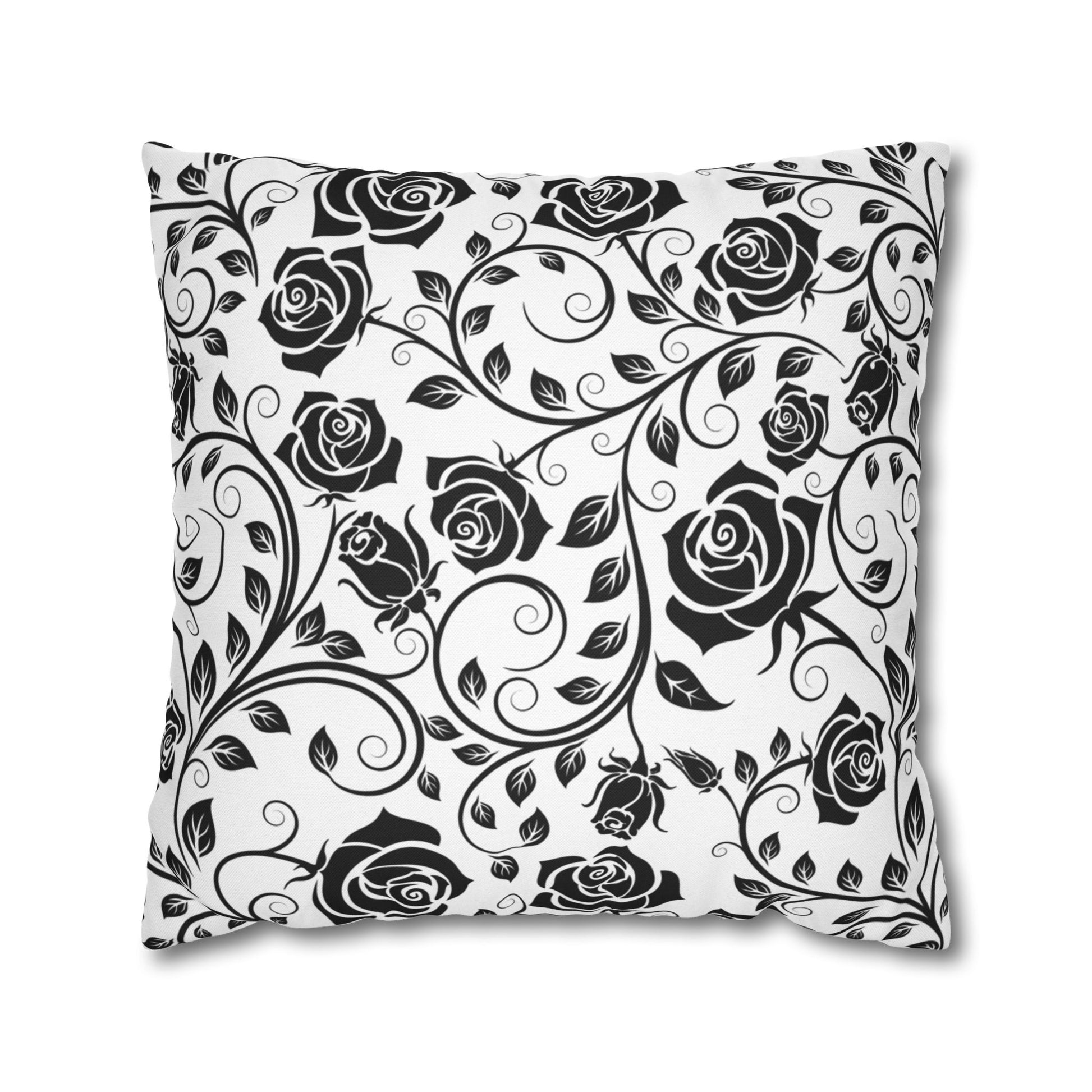 Decorative pillow with black rose pattern on a white background